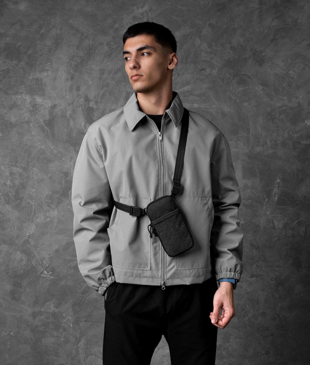 Angle. ALPAKA - Modular Shoulder Pocket Slim Phone Sling Bag, Crossbody Pouch with Card Sleeve, Belt/Bag Attachment - Black Ultradyne 100D.