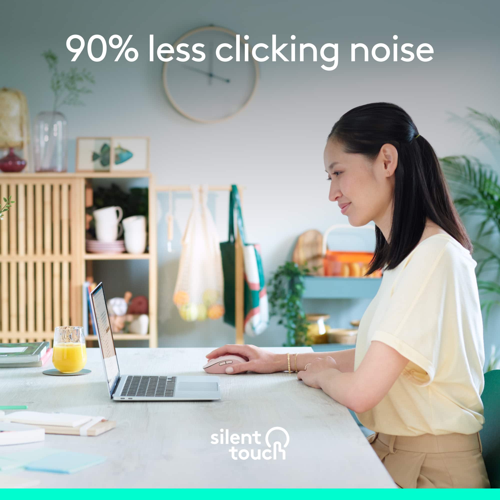 The text on the image reads "90% less clicking noise silent touch." This suggests that the laptop being used by the woman in the image has a silent touch feature, which reduces the noise generated by the keyboard when typing. This feature is particularly useful in quiet environments or when working in shared spaces, as it helps minimize distractions and maintain a more peaceful atmosphere.