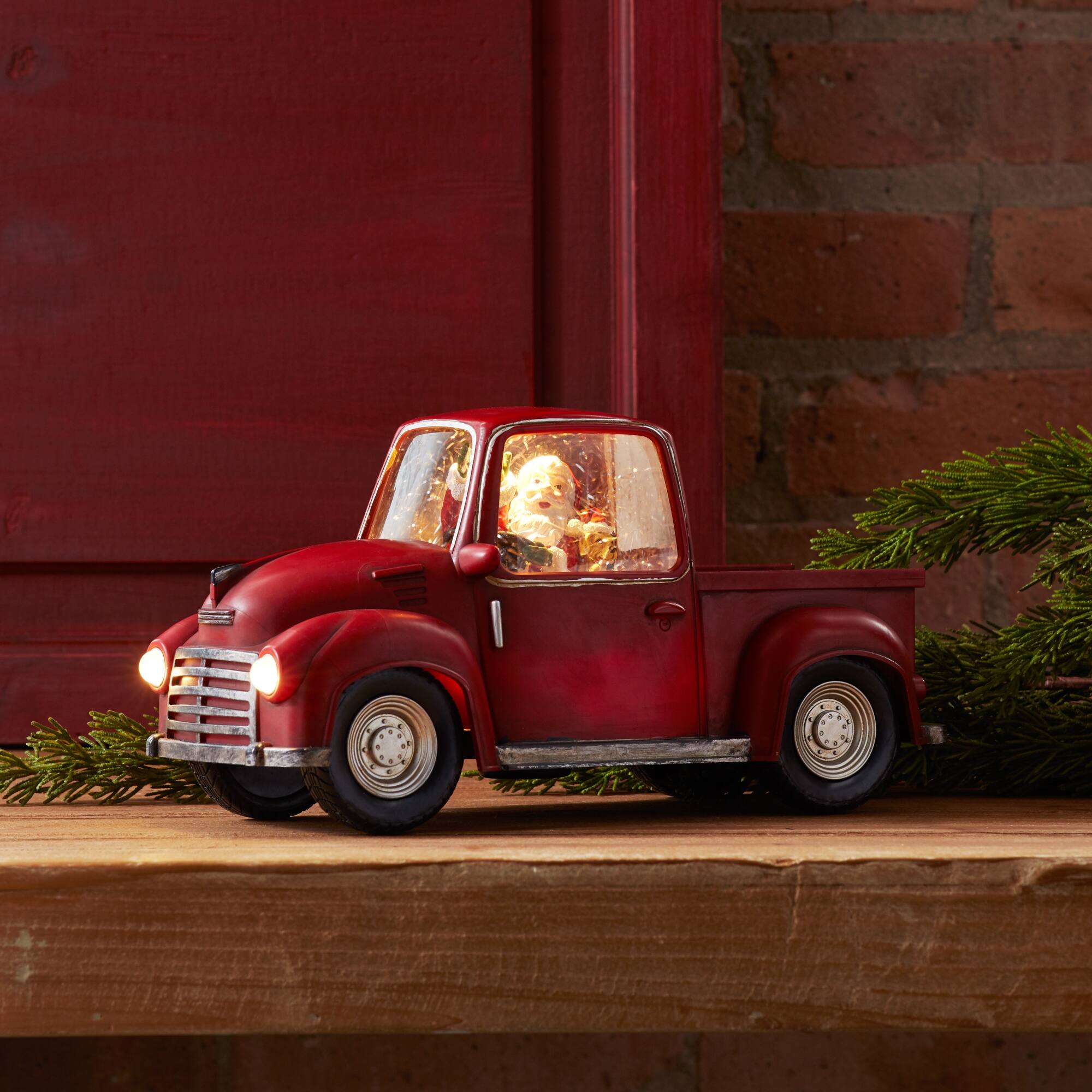 Angle. BreeBe - LED Snow Globe Truck with Santa 11.25"L - Red, White.