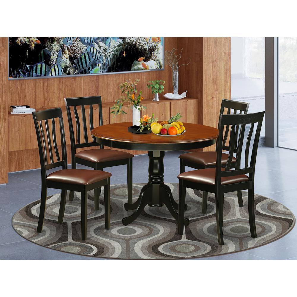 Back. East West Furniture - 5 Pc set with a Round Dinette Table and 4 Leather Dinette Chairs in Black - Black.