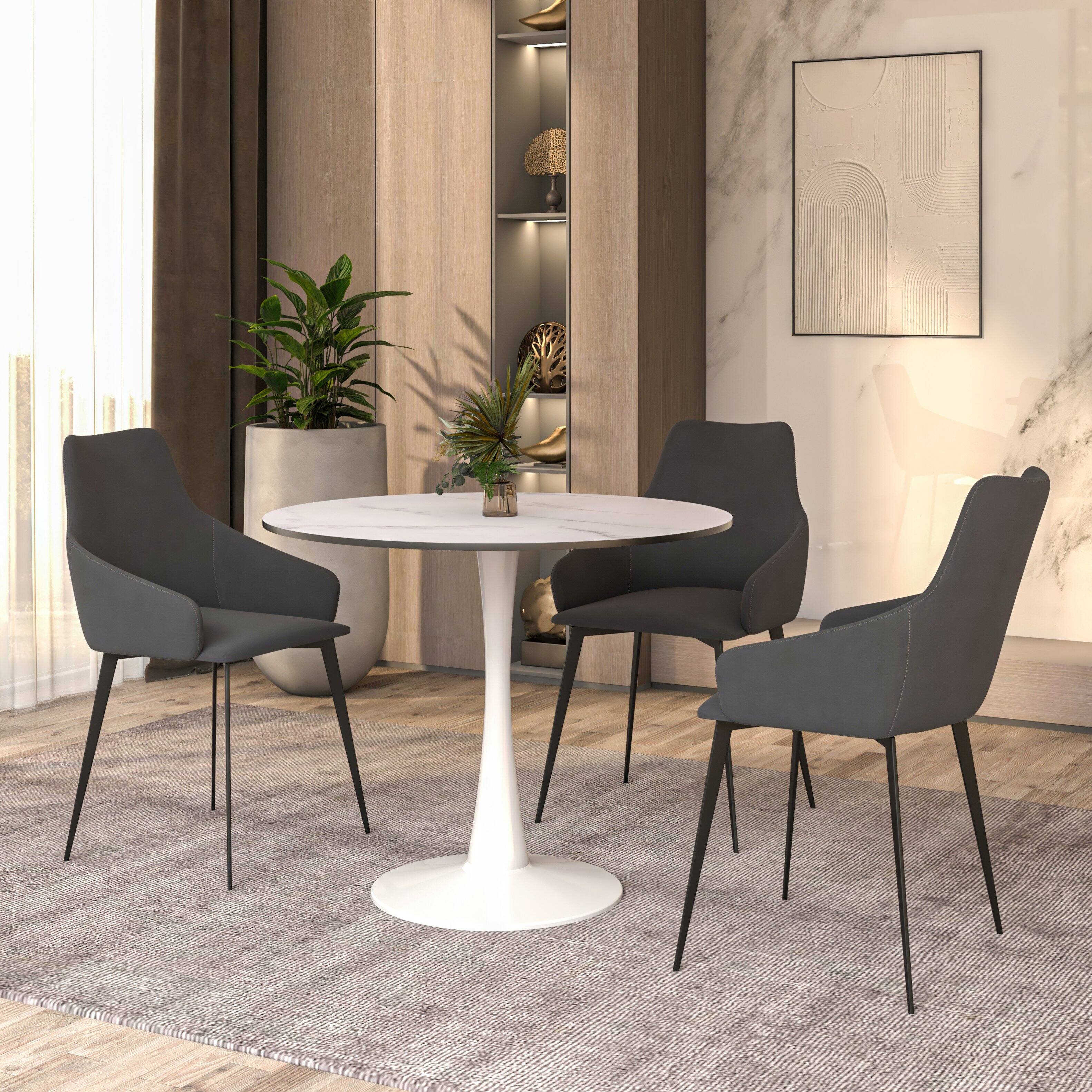 Angle. LeisureMod - Bristol Modern 35" MDF/Stone Round Dining Table, Mid-Century with White Pedestal Base for Kitchen - MDF - Marbled White.