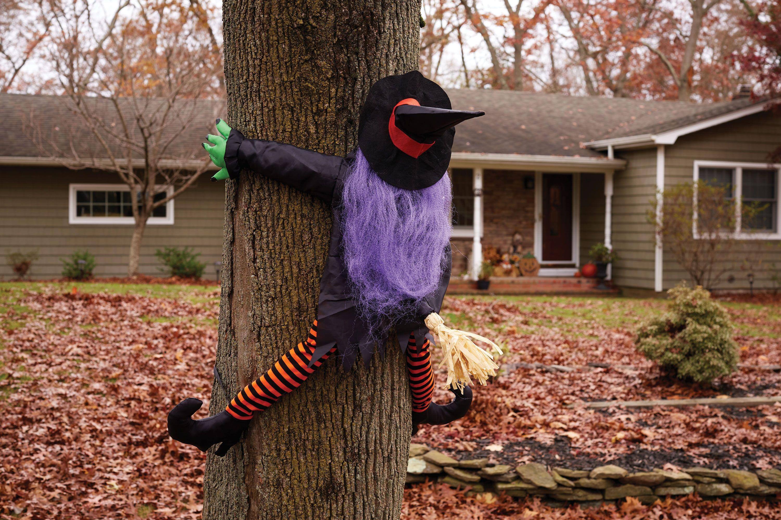 Front. Funworld - Wrong Way Witch Halloween Décor Tree Hugger - Purple.