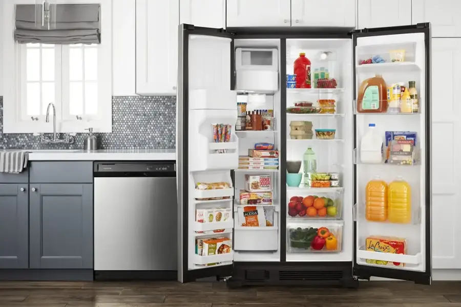 The refrigerator is filled with various food items, including a bottle of La Croix water, a carton of milk, and a bottle of juice. The refrigerator is also stocked with a variety of other items such as fruits and vegetables.