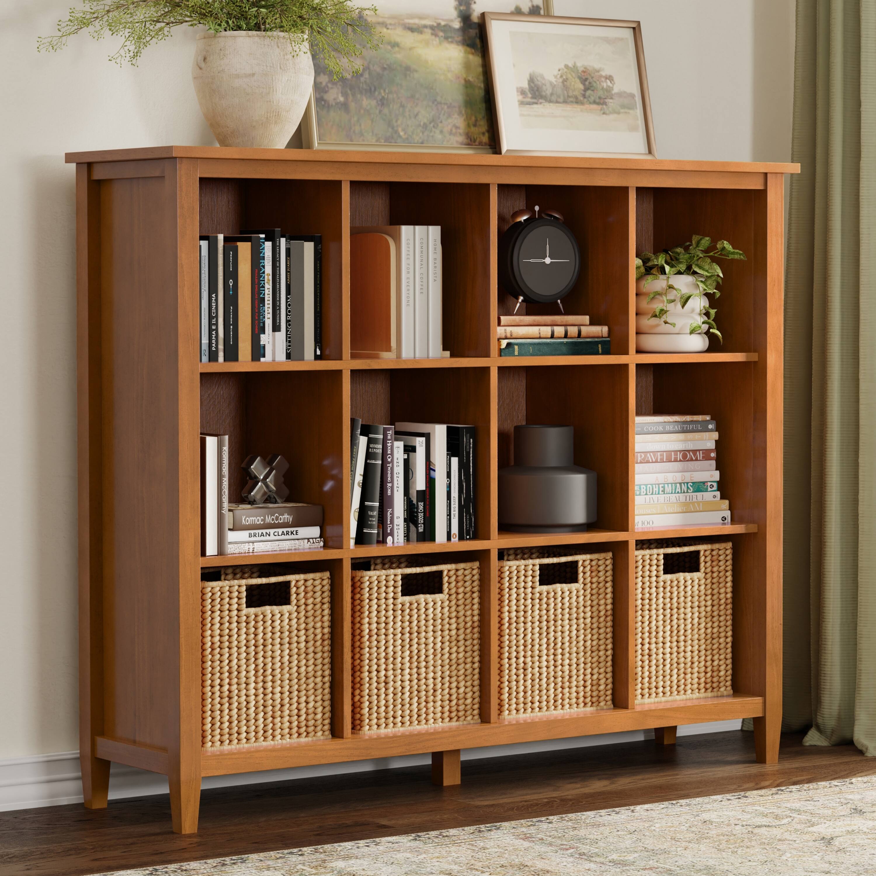 Sure, here is the corrected and grouped text from the image:

---

**Top Shelf:**
- (Image of a landscape)

**Second Shelf:**
- (Image of a plant in a pot)

**Third Shelf:**
- (Clock)

**Fourth Shelf:**
- "Katie McCarthy"
- "BRIAN CLARKE"
- "PAVEI HOME"
- "BOHEMIANS"
- "COOK BEAUTIFUL"

**Bottom Shelf:**
- (Wicker baskets)

---