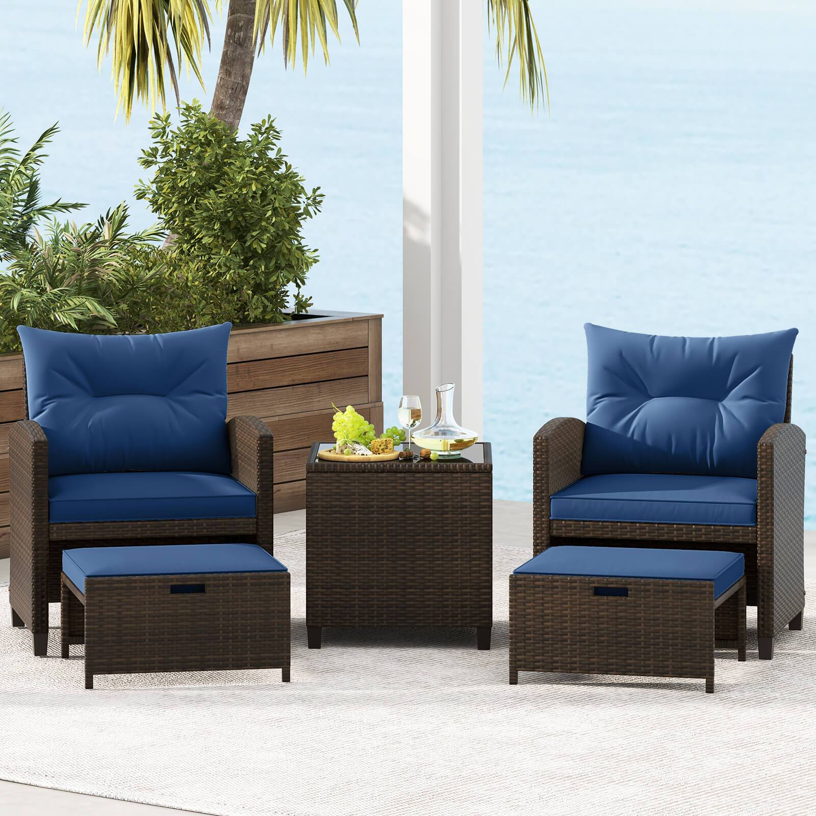 Alt View 4. Costway - 5 PCS Patio Rattan Furniture with 2 Wicker Ottomans & Tempered Glass Coffee Table - Navy + Mix Brown.