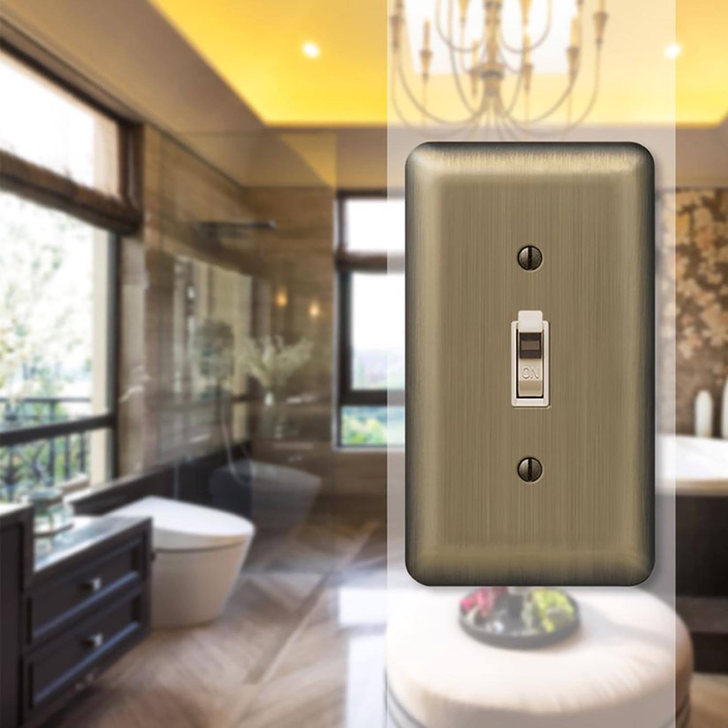 Left. AMERELLE - Amerelle Devon Brushed Brass 1 gang Stamped Steel Toggle Wall Plate 1 pk - Brass.