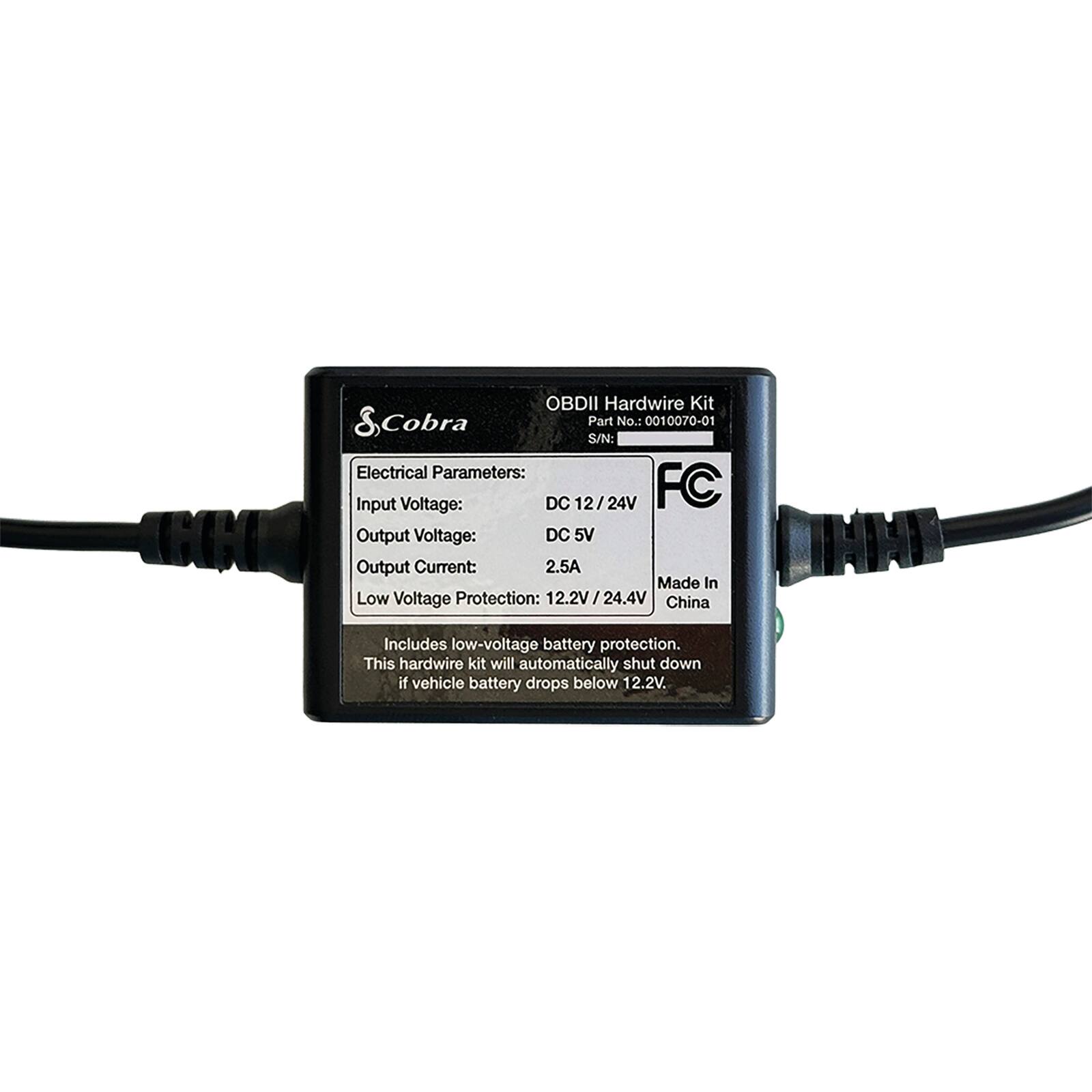 The text on the image is grouped and corrected as follows:

"IHK OBDII Hardwire Kit & Cobra Part No.: 0010070-01 S/N: Electrical Parameters: Input Voltage: DC 12/24V FC Output Voltage: DC 5V Output Current: 2.5A Made In Low Voltage Protection: 12.2V/24.4V China INNI Includes low-voltage battery protection. This hardwire kit will automatically shut down if vehicle battery drops below 12.2V."
