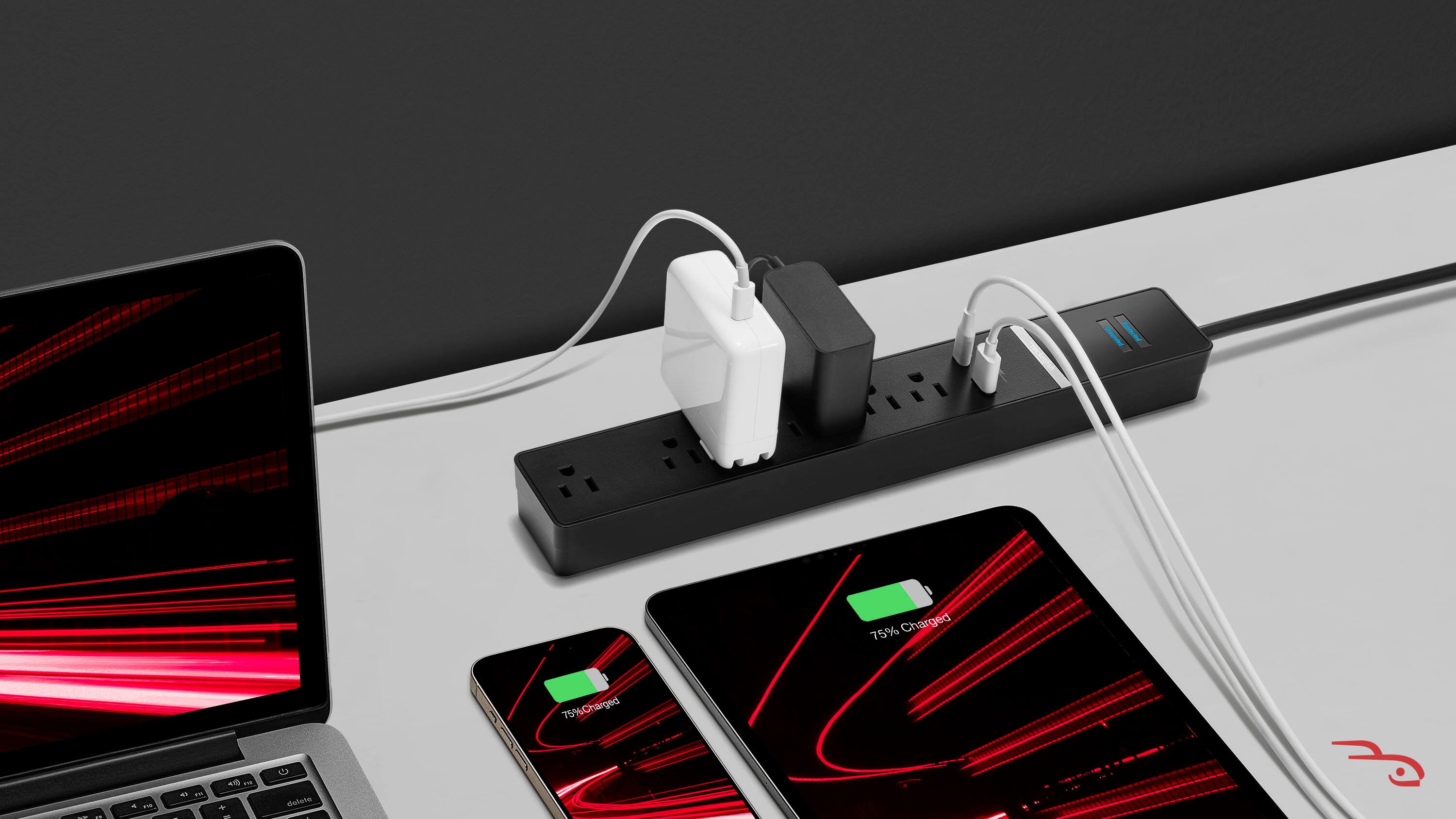 The image shows a laptop and two cell phones placed on a table. The laptop is on the left side of the table, while the two cell phones are on the right side. The cell phones are both charging, with one of them showing 75% charged and the other showing 75% charged as well. The laptop is also charging, with its charger plugged into a power strip. The scene suggests that the devices are being charged and prepared for use.