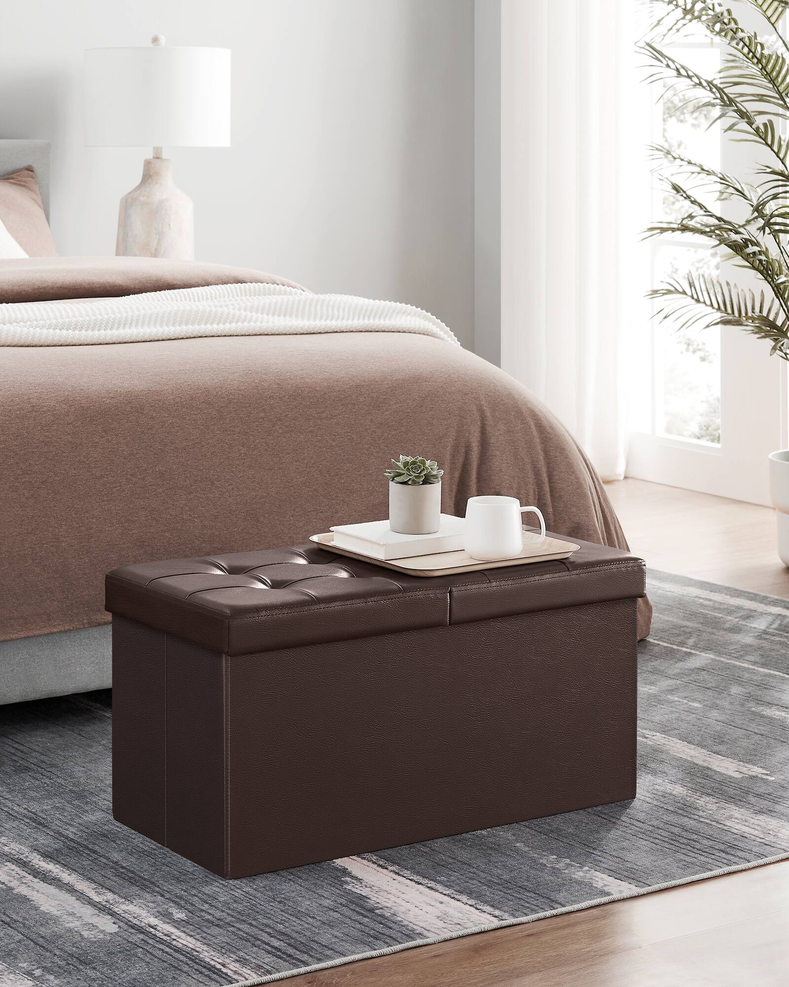 Left. Songmics Home - 30 Inches Folding Storage Ottoman Bench with Flipping Lid, Storage Chest Footstool, Faux Leather - Brown.