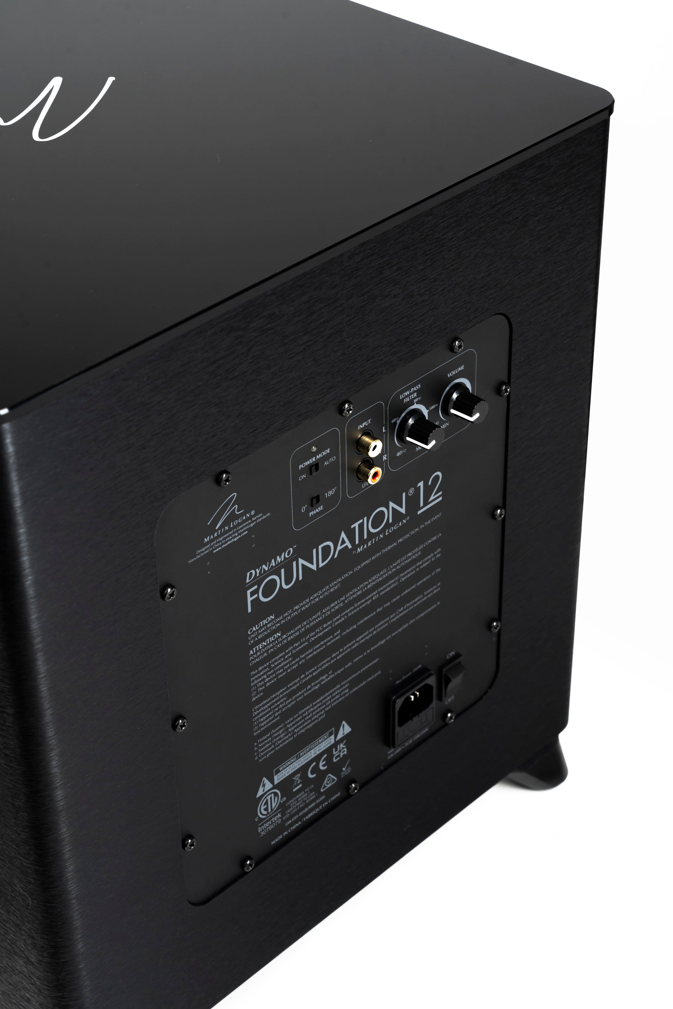 The text on the image reads: "N Foundation 12 - 8 Ohm - Autoformer - 180 Watts - Martin Logan - Dynamo - Attention: Please read the instruction manual before using this equipment."