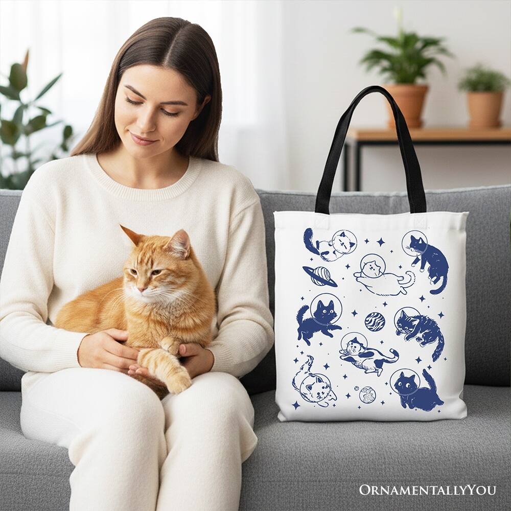 Left. OrnamentallyYou - Cats in Space Retro Canvas Tote Bag, Funny Astronaut Kitty Gift Bag with Cosmic Vibes - White Black.