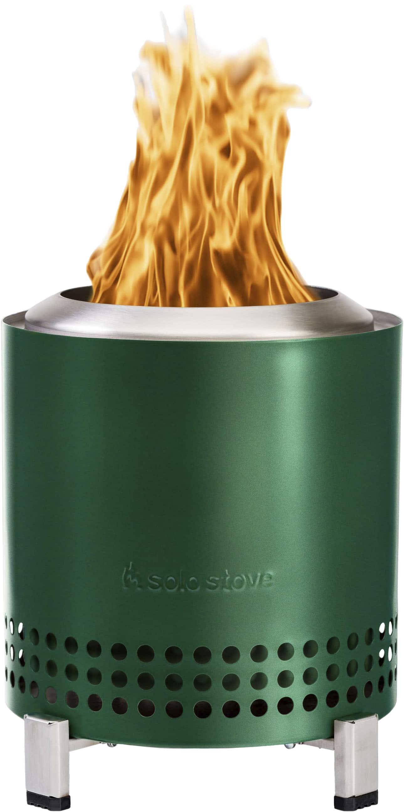 The image features a green stove with a fire burning inside of it. The stove is designed to be portable and efficient, making it a convenient choice for outdoor cooking or camping. The flames inside the stove are visible, indicating that it is actively being used. The stove is likely made of durable materials and features a ventilation system to ensure proper airflow and prevent overheating. Overall, the stove is a practical and reliable option for those who need a compact and efficient cooking solution.