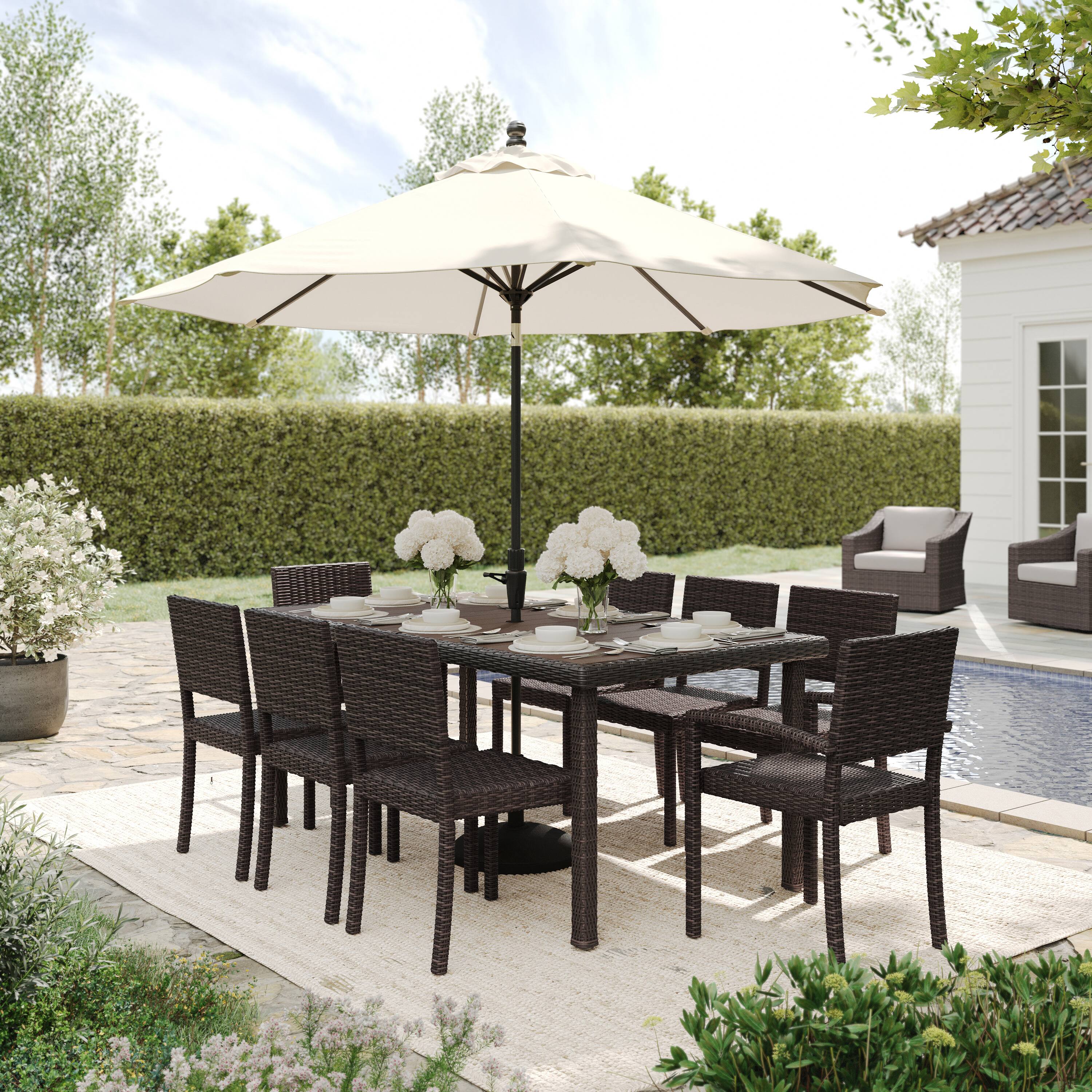 Alt View 4. Martha Stewart - Bedford 9pc Outdoor Rattan Wicker Patio Dining Set with 8 Stack Chairs and 71" Table - Brown.