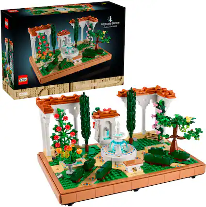 The image features a Lego set that includes a fountain garden and a display of trees. The set is designed for adults and requires 1302 pieces to complete. The box for the set is black and white, and it is displayed next to the completed Lego creation. The display showcases the intricate details of the garden and the trees, making it an impressive and visually appealing model.