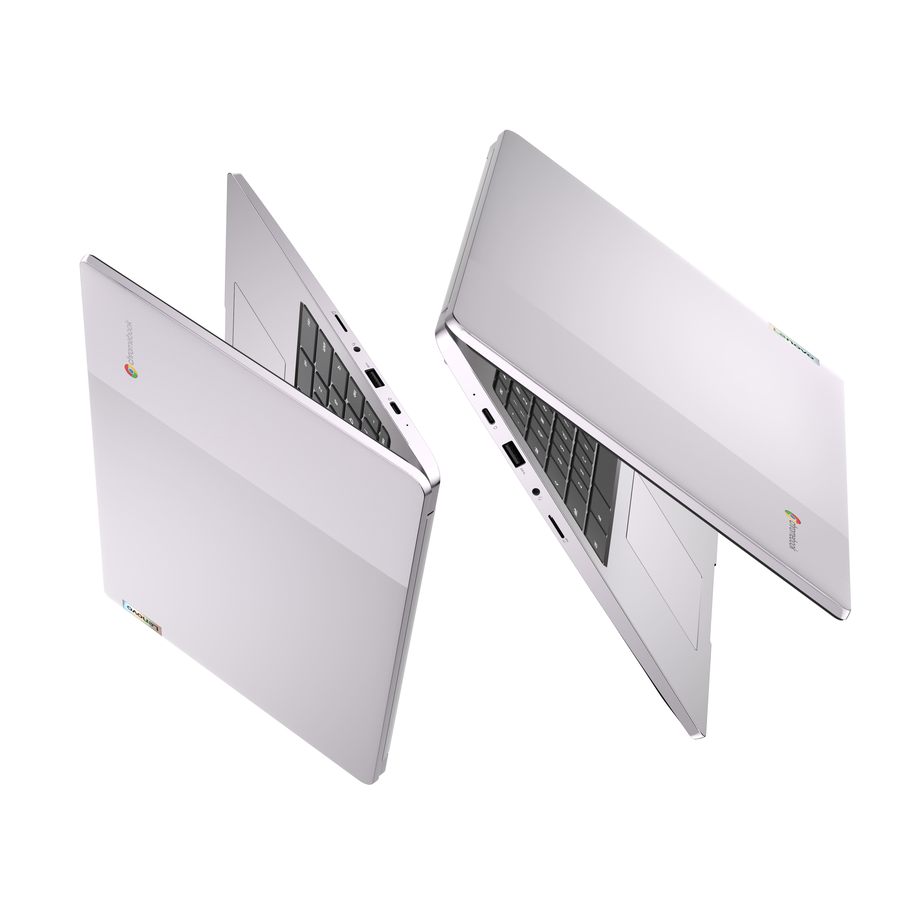 The image shows two white laptops placed side by side. They are both open, revealing their keyboards and screens. The laptops are positioned in such a way that they appear to be facing each other, creating an interesting visual effect. The laptops are likely part of a product display or a demonstration, showcasing their design and features.