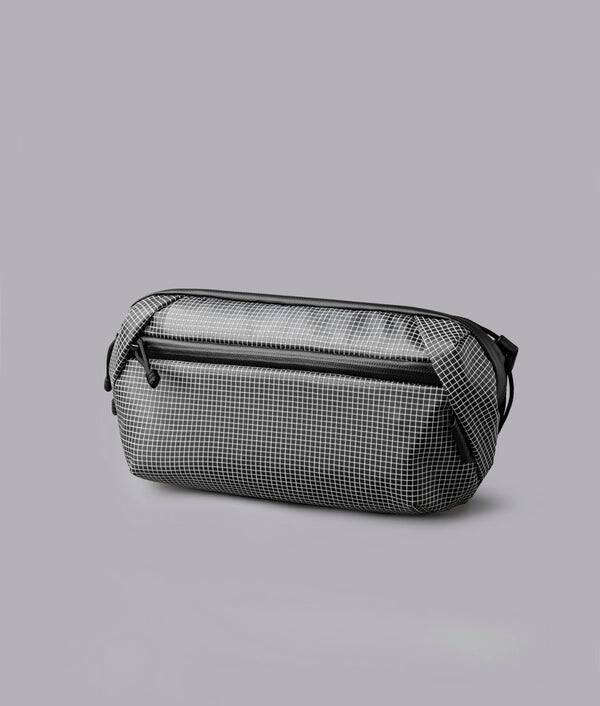 Alt View 10. ALPAKA - Lightweight Crossbody Sling Bag for Travel, Phone, Wallet & Passport, Momentum Sling, Weather-Resistant - Axodyne hybrid Grey.