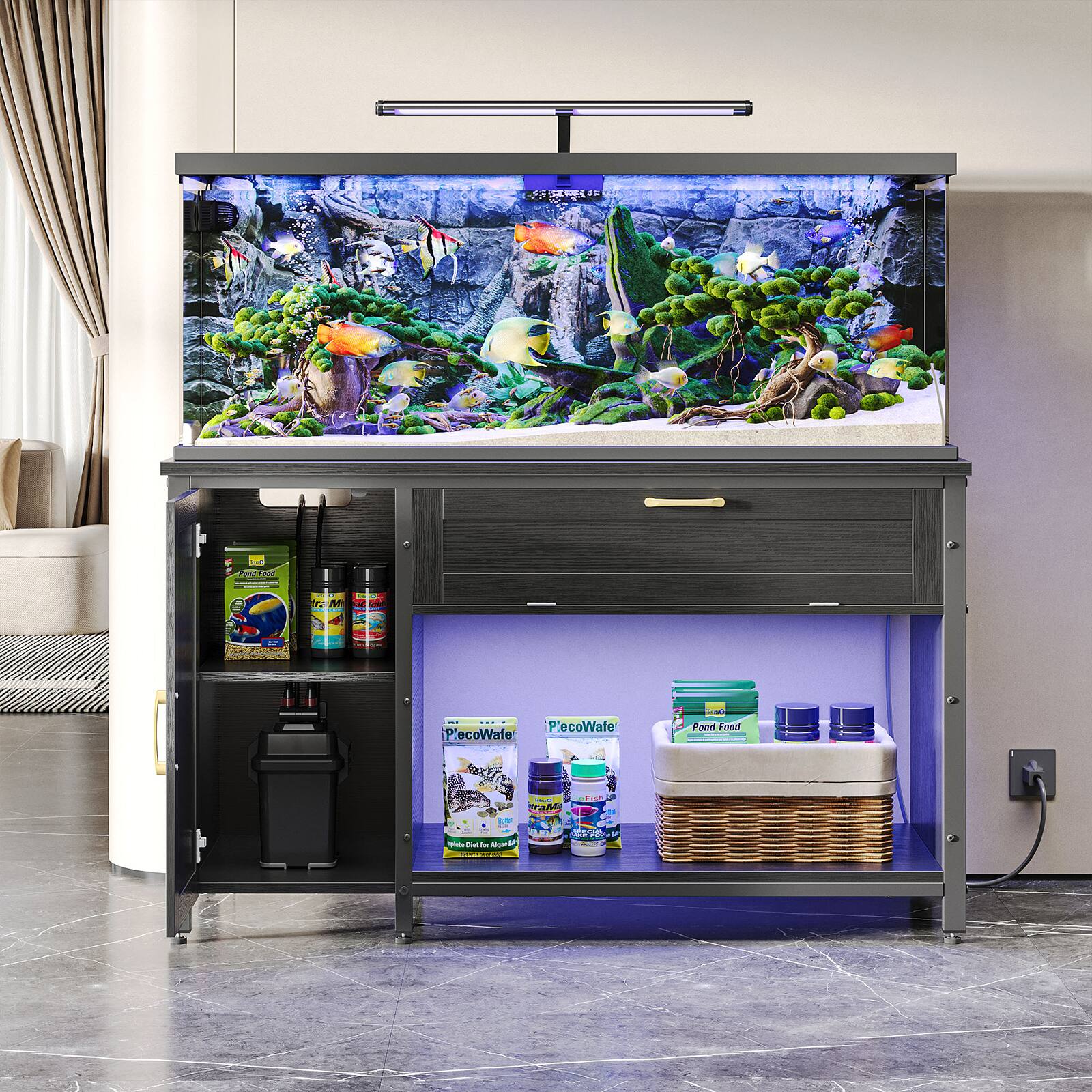 The image features a large aquarium with a purple light underneath it. The aquarium is filled with various fish and plants, creating a vibrant and lively atmosphere. The aquarium is placed on a black stand, which also has a shelf with fish food and other supplies. The stand is situated in a living room, adding a touch of nature and color to the space.