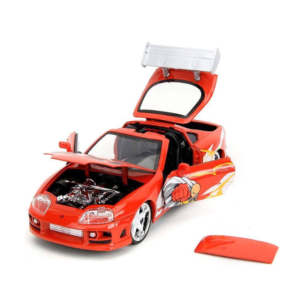 Angle. Jada - 1995 Toyota Supra Red with Graphics and Saitama Diecast Figure "One Punch Man" (2015-2019) TV Series 1/24 - Red.
