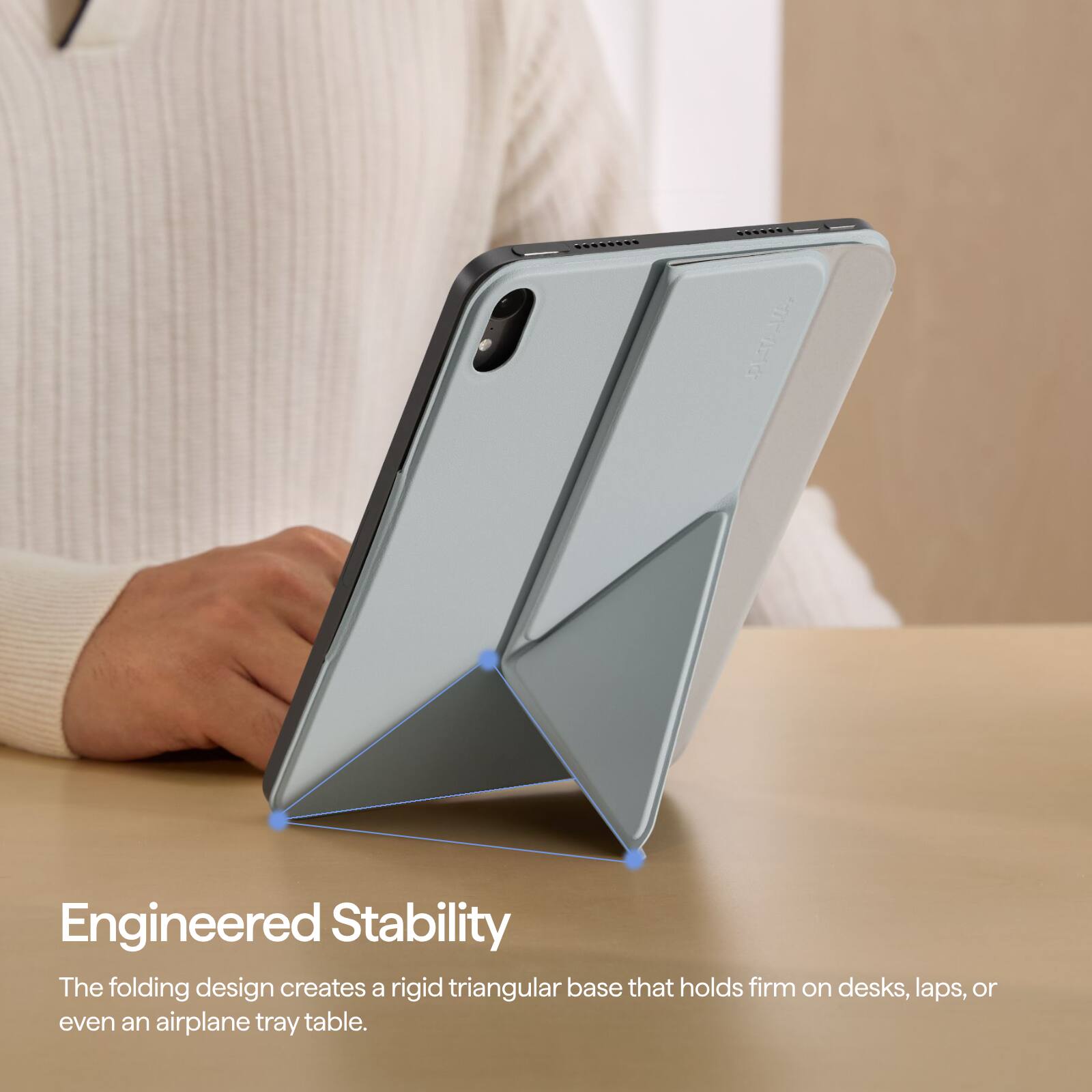Engineered Stability  
The folding design creates a rigid triangular base that holds firm on desks, laps, or even an airplane tray table.