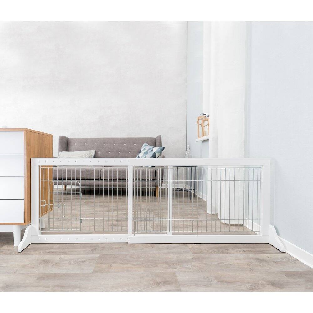 Angle. TRIXIE - Expandable Wooden Freestanding Pet Gate with Pet Door, Expands to 71" Wide - White.