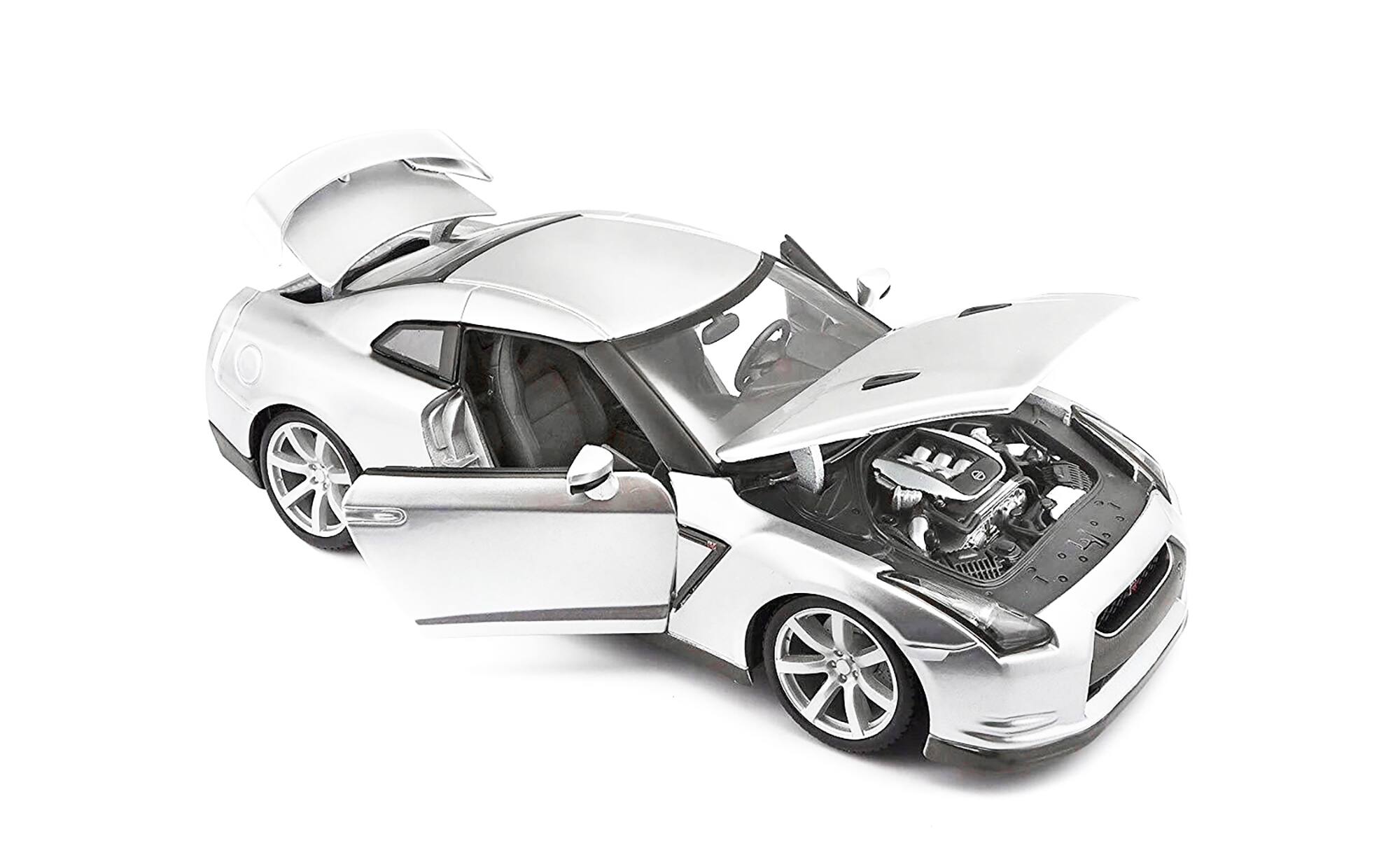 Left. Bburago - 2009 Nissan GT-R R35 Silver 1/18 Diecast Model Car by Bburago - Silver.