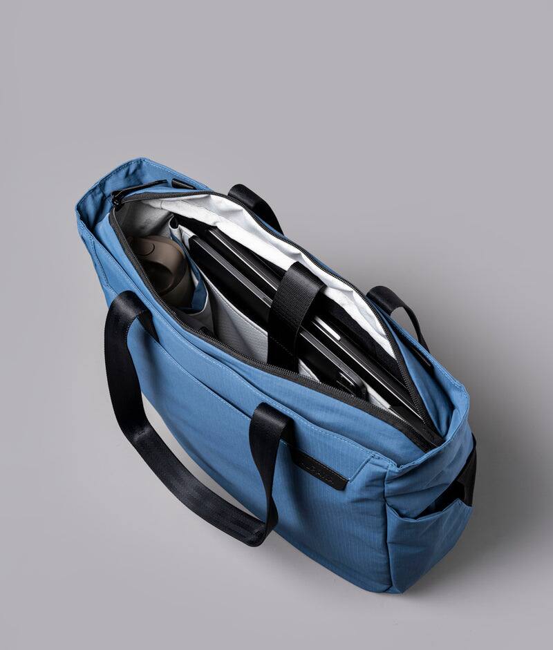 Angle. ALPAKA - Metro Tote Laptop Tote Bag for Work, Work Tote Fits 16" MacBook Pro, Side Bottle Pocket, Weather-Resistant, Key Tether - Blue Axoflux 210D.