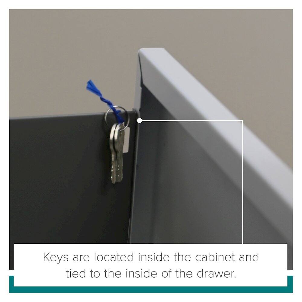 Keys are located inside the cabinet and tied to the inside of the drawer.