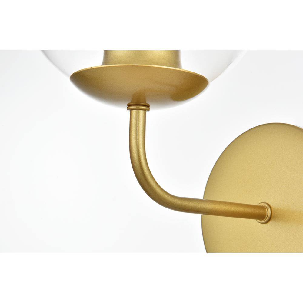 Angle. Living District - Genesis 1 light Brass and Clear Bath Sconce - Brass And Clear.