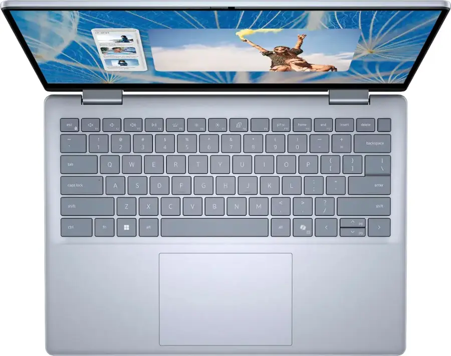 The image shows the keyboard of a laptop computer. The keys are arranged in rows, with the top row containing the function keys and the bottom row containing the number keys. The keyboard also has a touchpad located to the right of the keys. The keys are labeled with their corresponding functions, such as the arrow keys, the number keys, and the function keys. The keyboard is designed to facilitate typing and navigation on the laptop.