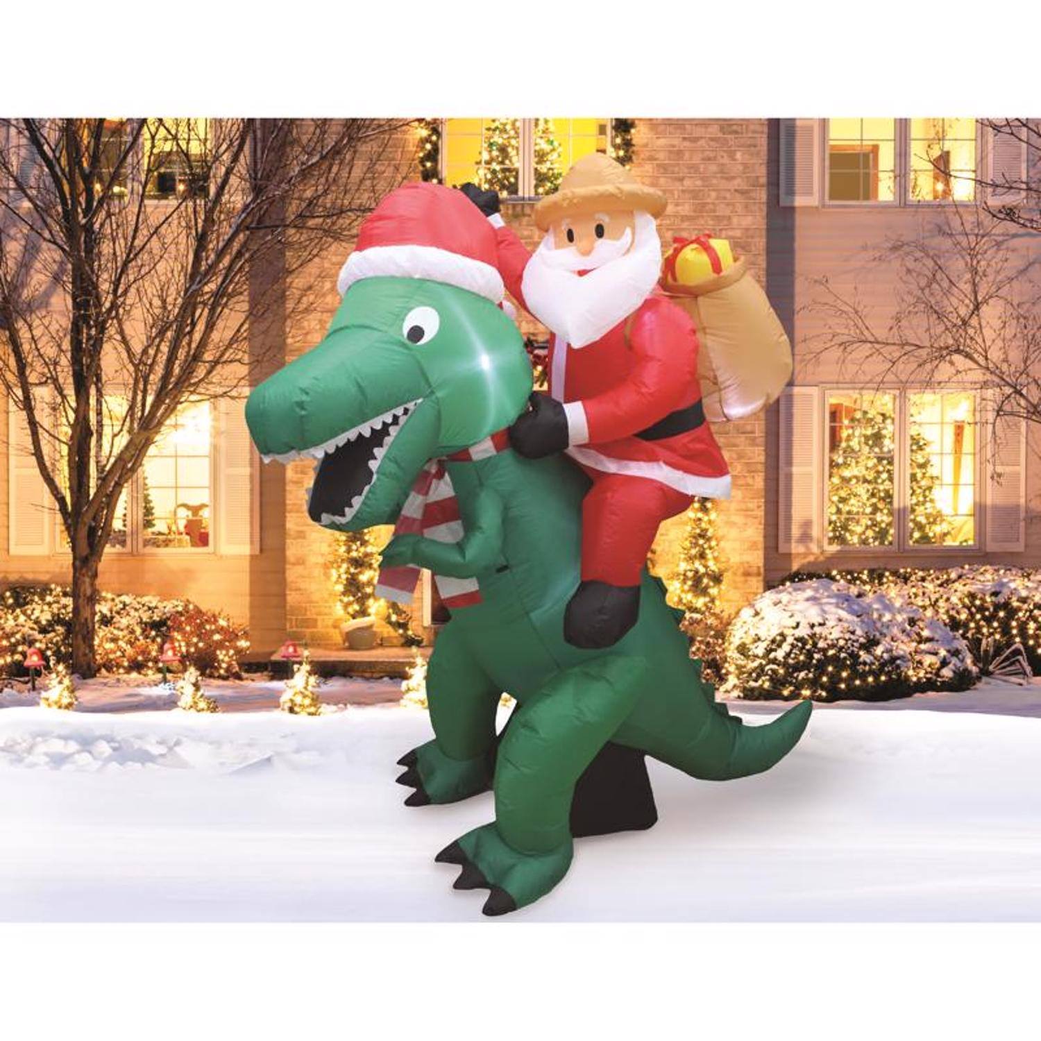 Left. A Holiday Company - A Holiday Company Jurassic Santa LED Dinosaur with Santa 6 ft. Inflatable - Multicolored.