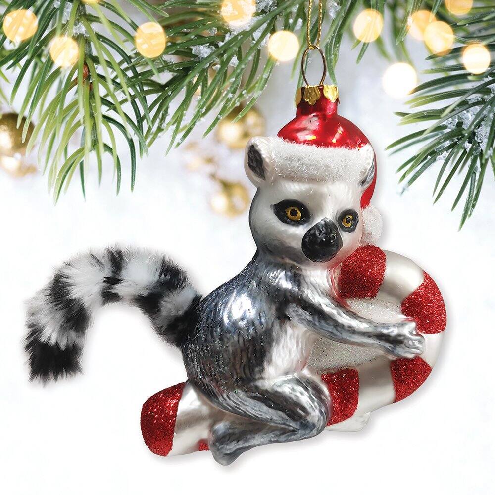 Left. OrnamentallyYou - Lemur Draped in Christmas Fun Glass Christmas Ornament Madagascar Ring Tailed Monkey - Multi-colored.