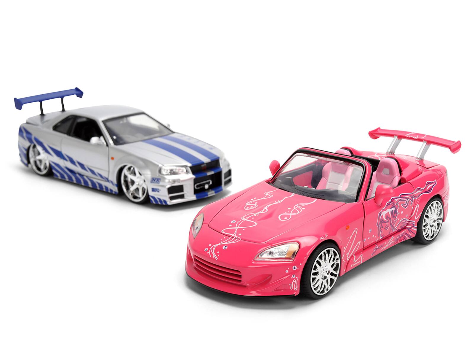 Alt View 2. Jada - Brian's Nissan Skyline GT-R (R34) Silver Metallic w/Blue & Suki's Honda S2000 Pink with Graphics 1/24 Model Cars by Jada.