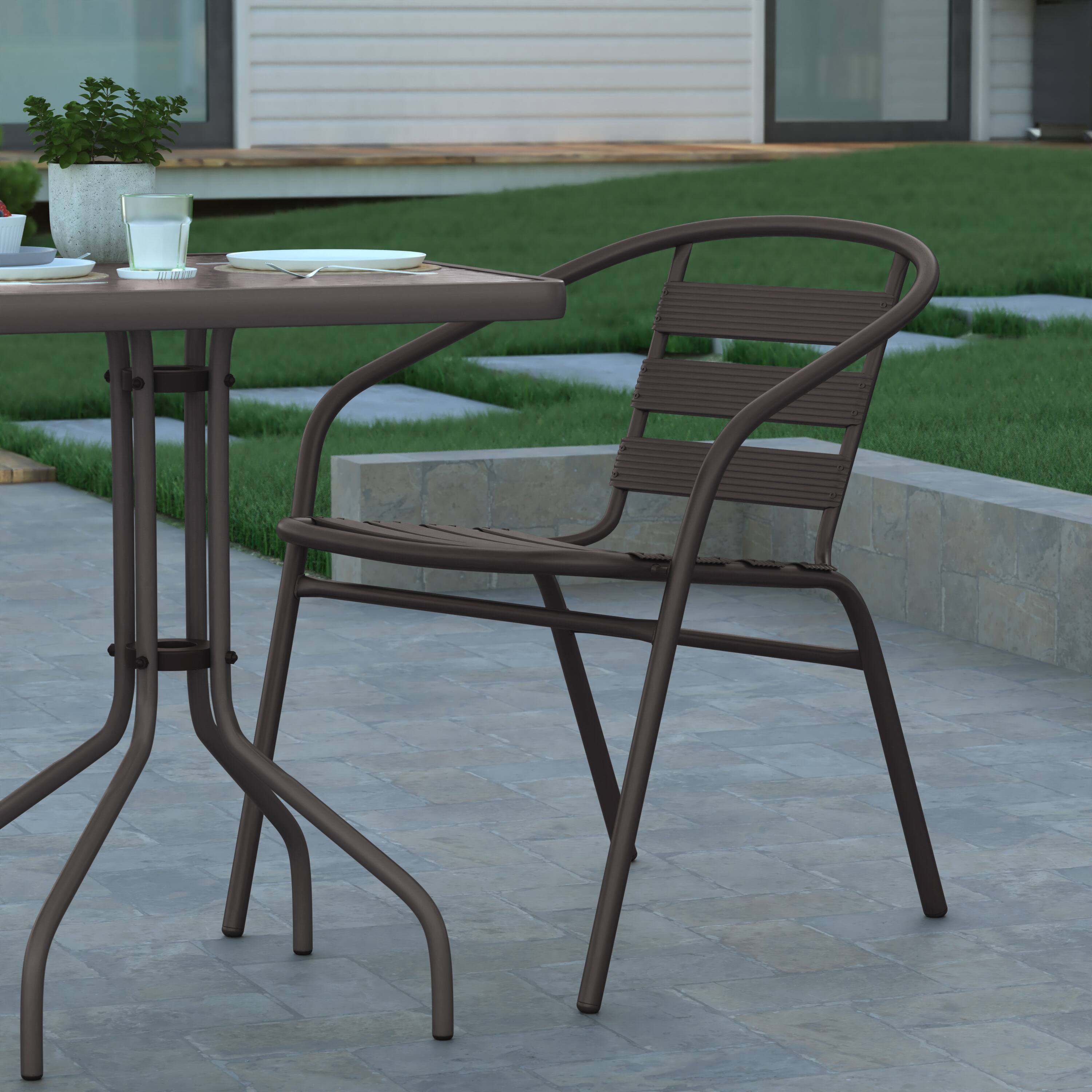 Alt View 5. Emma + Oliver - Rhea 23.5'' Square Glass Top Metal Table with 2 Aluminum Slat Stack Chairs - Bronze.