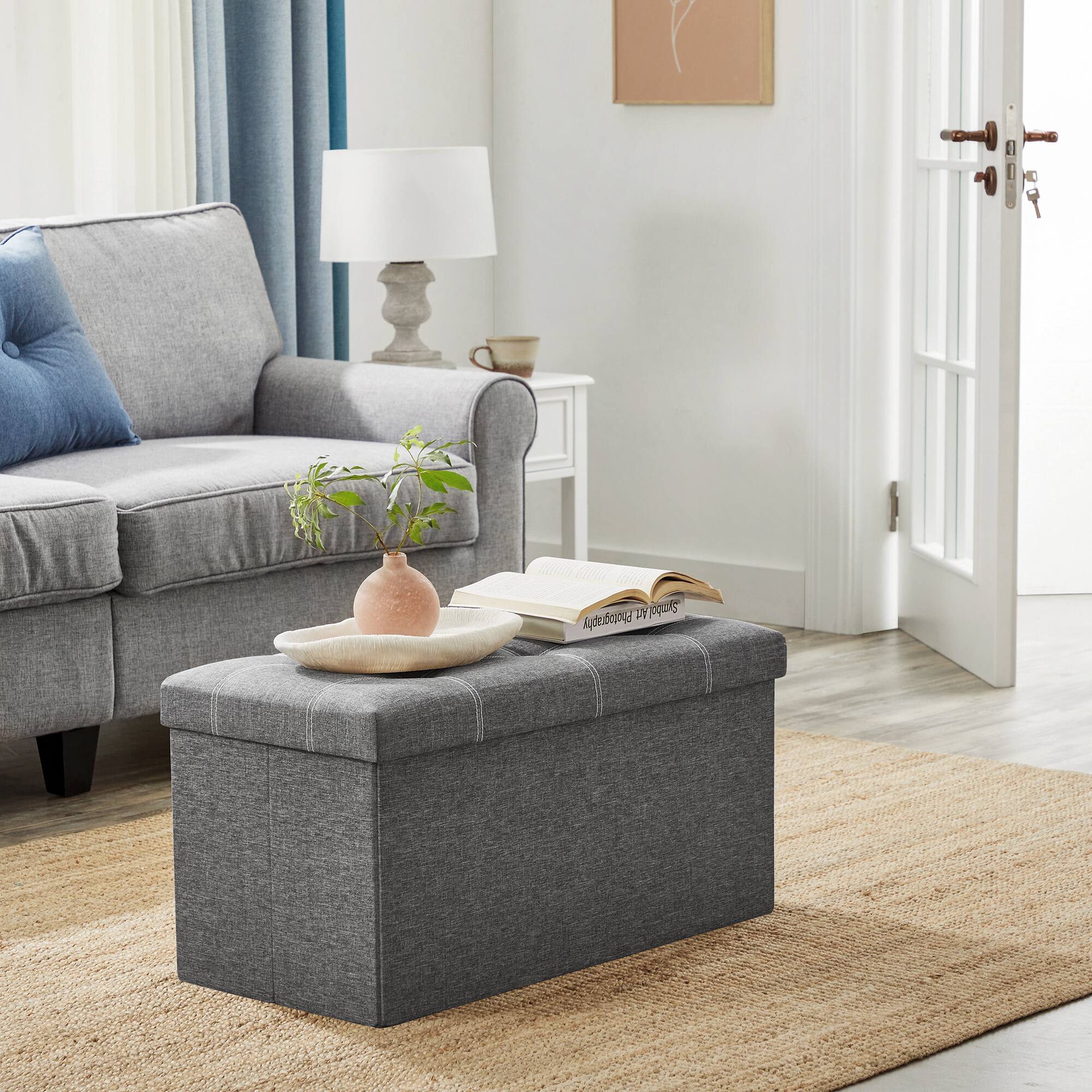 Angle. Songmics Home - Ottoman Storage Bench, 21 Gal. Folding Chest with Breathable Linen-Look Fabric, Holds 660 lb - Dark Gray.