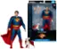 The image features a Superman action figure and a dog figure, both part of the DC Multiverse Edition. The action figure is wearing a cape and is posed next to the dog figure. The packaging for the action figure is displayed, showcasing the articulated parts and theatrical edition details. The Superman and Krypto figures are designed by McFarlane Toys.