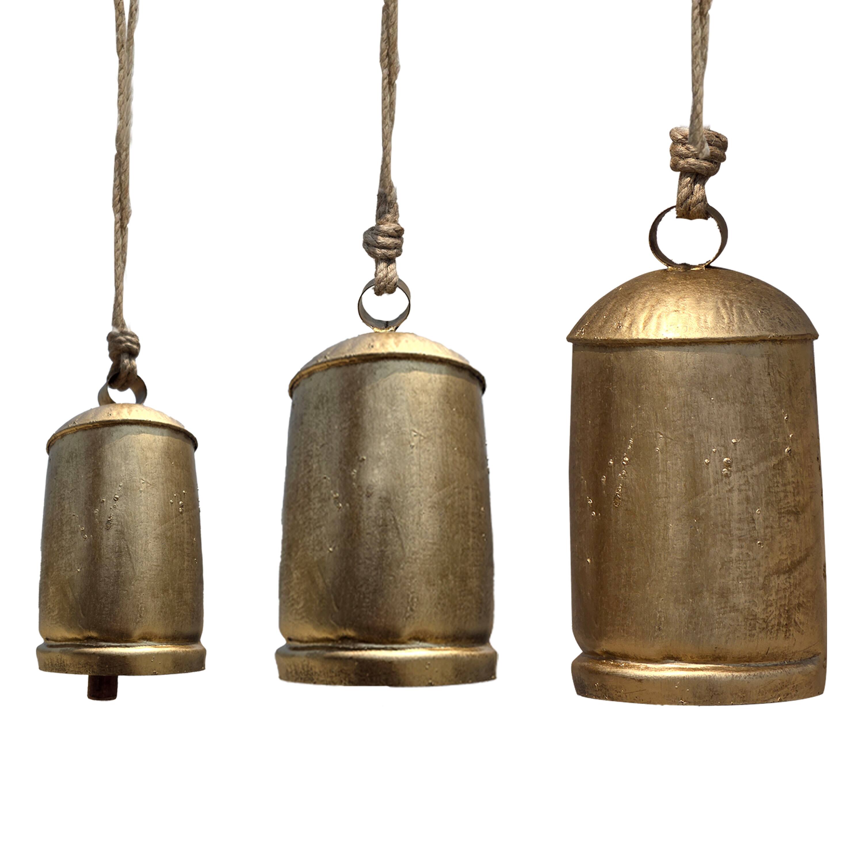 Angle. Manhattan Lane - Zaira Decorative Iron Cow Bells Set of 3 | Cylindrical | Antique Gold Finish| Jute Hanging Rope | 20, 15, 12 Inches - Gold.