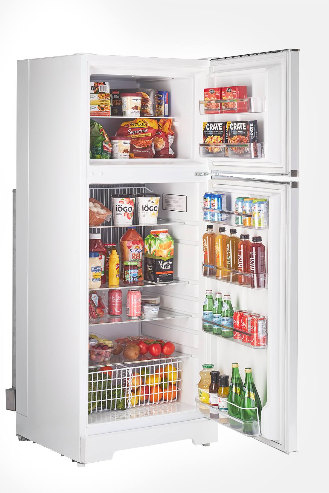 The refrigerator is filled with various food items and drinks. The shelves contain a variety of bottles, including water, juice, and soda. There are also several hot dogs and a bowl of food. The refrigerator is well-stocked and ready for use.