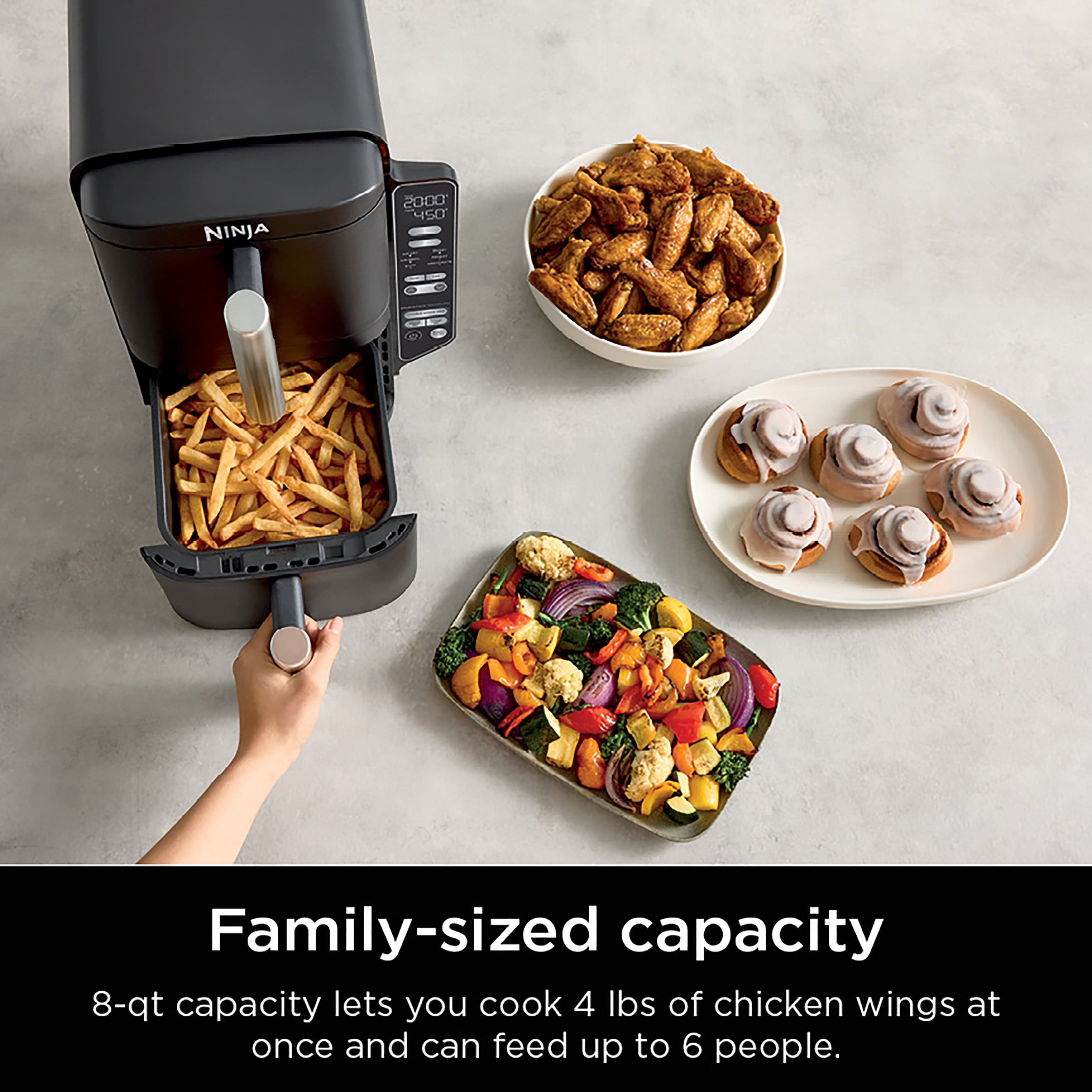 The image features a Ninja 2000 450 Family-sized capacity appliance, which has an 8-qt capacity. This appliance allows you to cook 4 lbs of chicken wings at once and can feed up to 6 people.