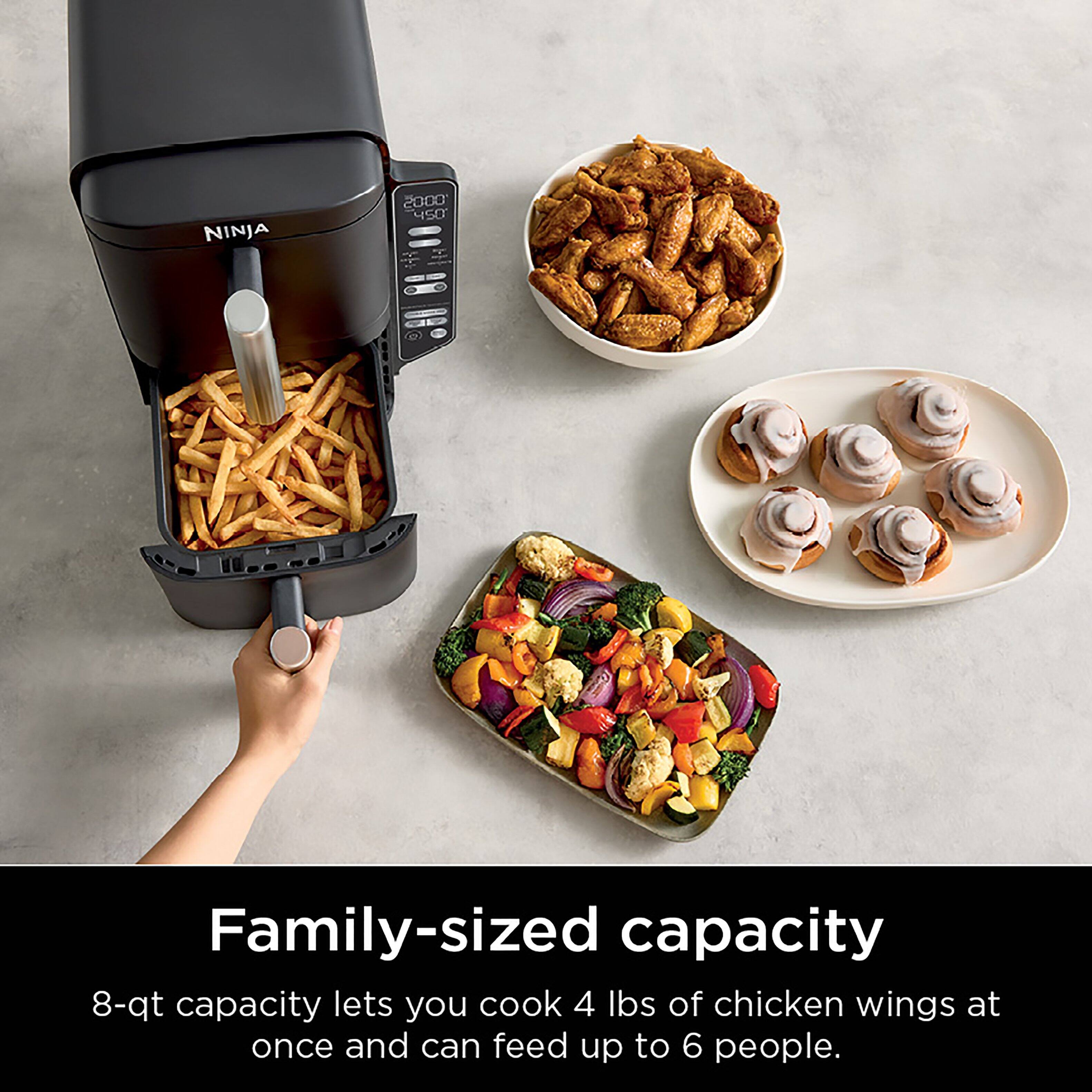 The image features a Ninja 2000 450 Family-sized capacity appliance, which has an 8-qt capacity. This appliance allows you to cook 4 lbs of chicken wings at once and can feed up to 6 people.