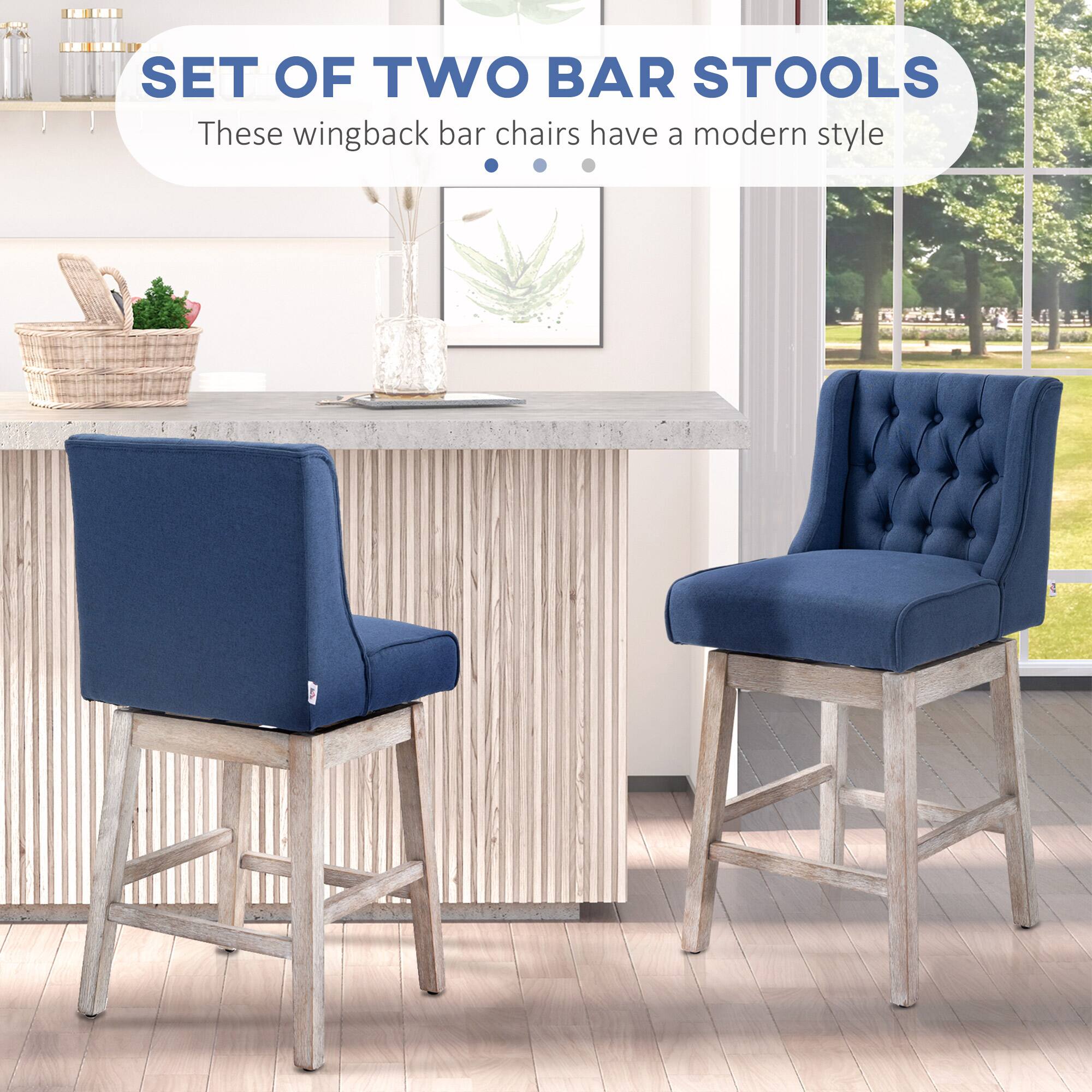 SET OF TWO BAR STOOLS

These wingback bar chairs have a modern style