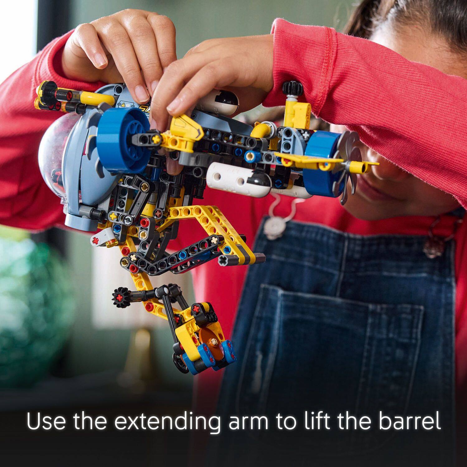 Use the extending arm to lift the barrel.