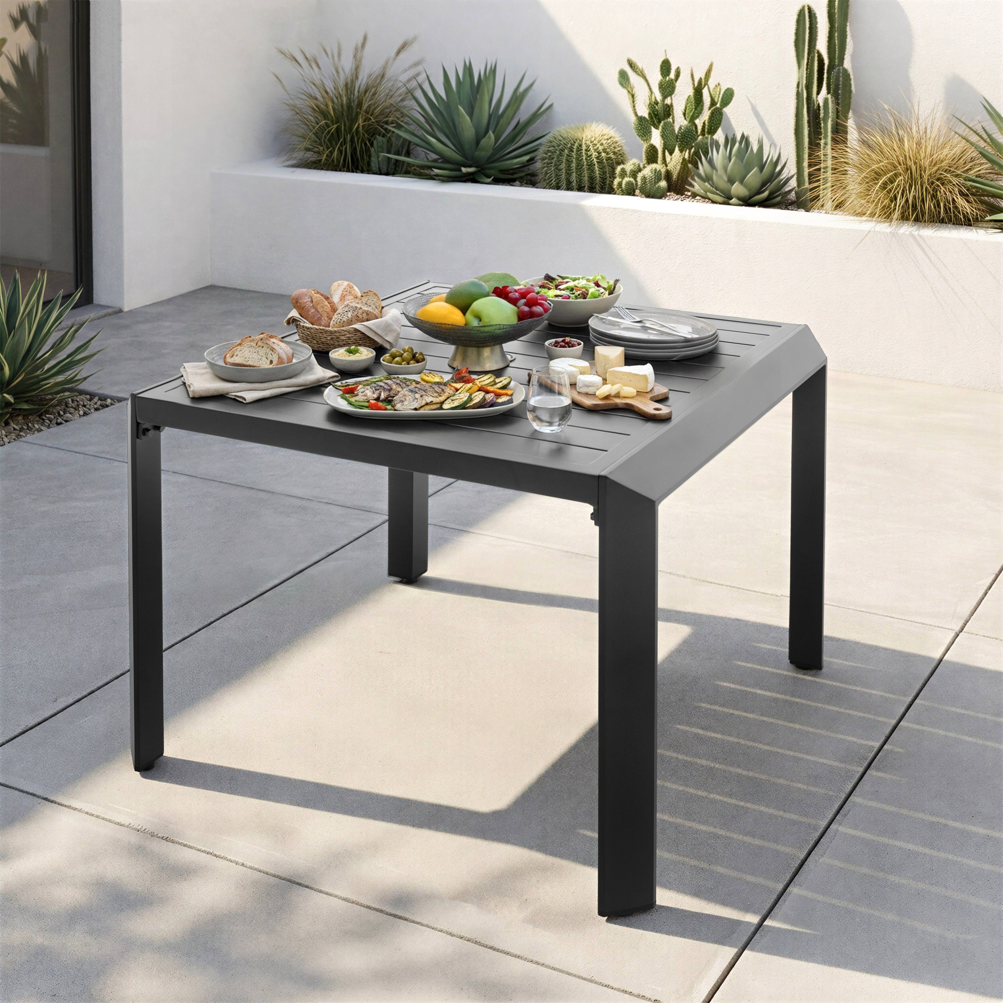 Angle. Nuu Garden - Outdoor Square Aluminum Dining Table with Umbrella Hole - Black.
