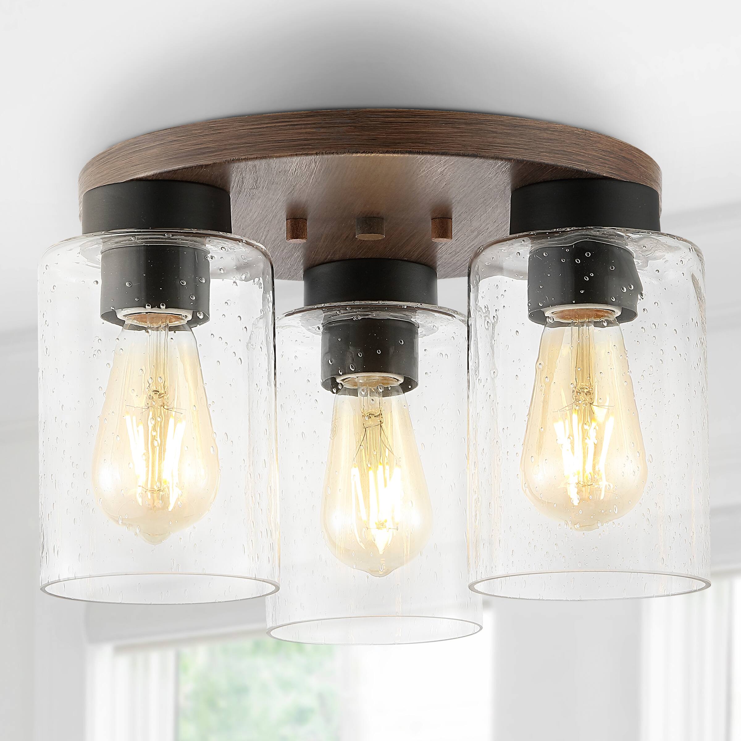 Alt View 1. Jonathan Y - Nola 13" 3-Light Bohemian Farmhouse Iron/Seeded Glass LED Semi Flush Mount, Wood Finish/Clear - Wood Finish.