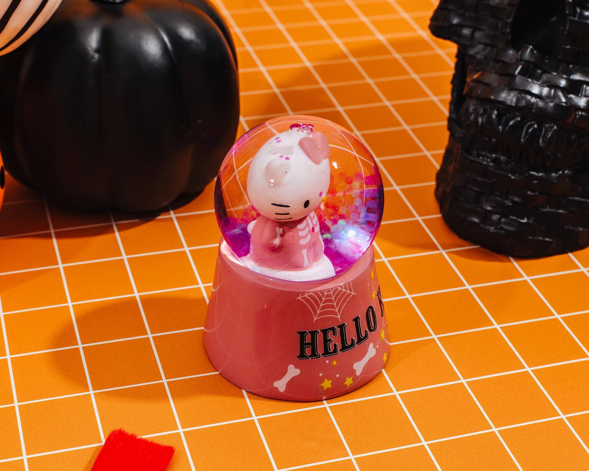 Alt View 5. Silver Buffalo - Sanrio Hello Kitty Pink Skeleton 3-Inch Mini Light-Up Snow Globe - Pink.
