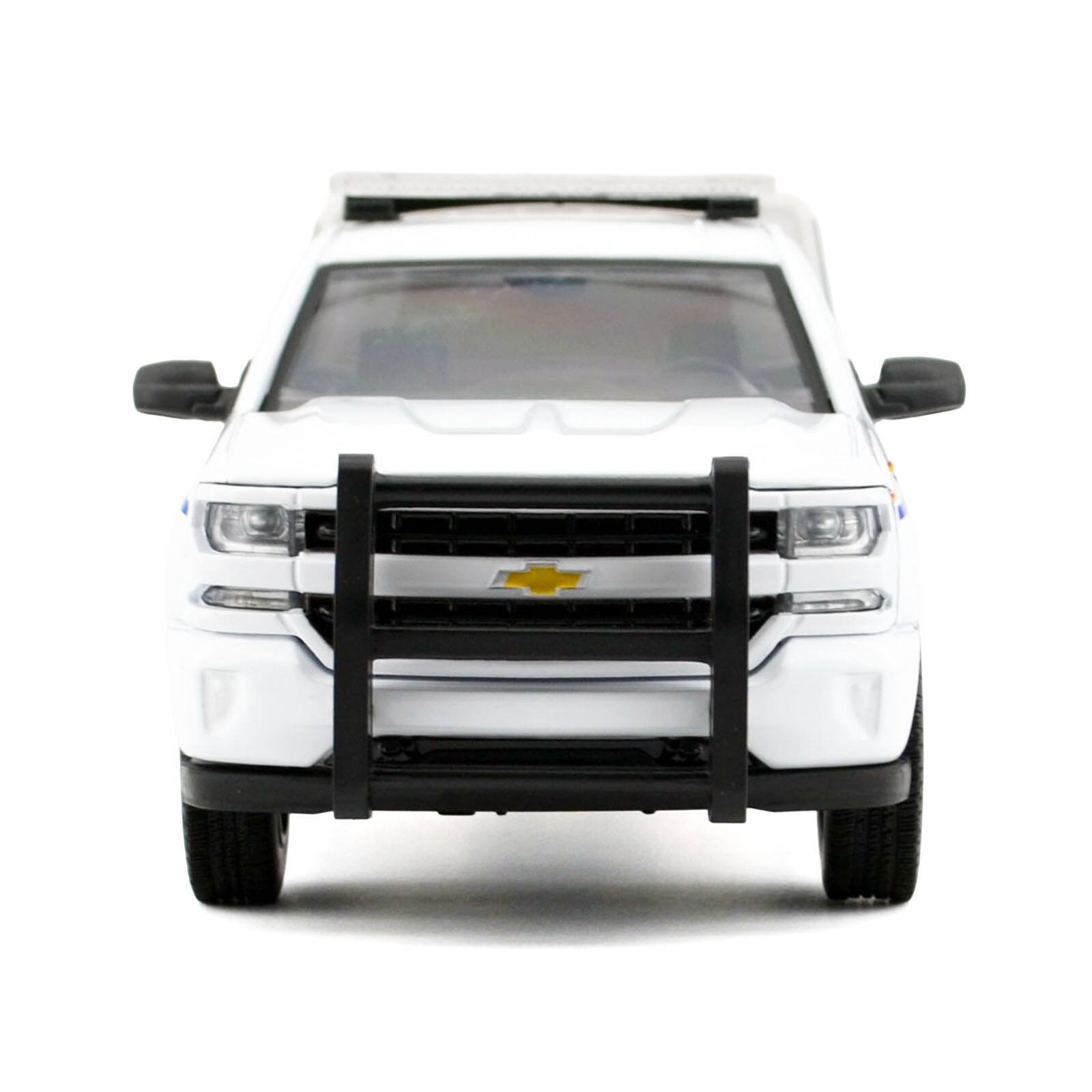 Alt View 3. Motormax - 2017 Chevrolet Silverado 1500 LT Z71 Crew Cab Truck with Camper Box "RCMP" White 1/24-1/27 Diecast Model Car by Motormax.