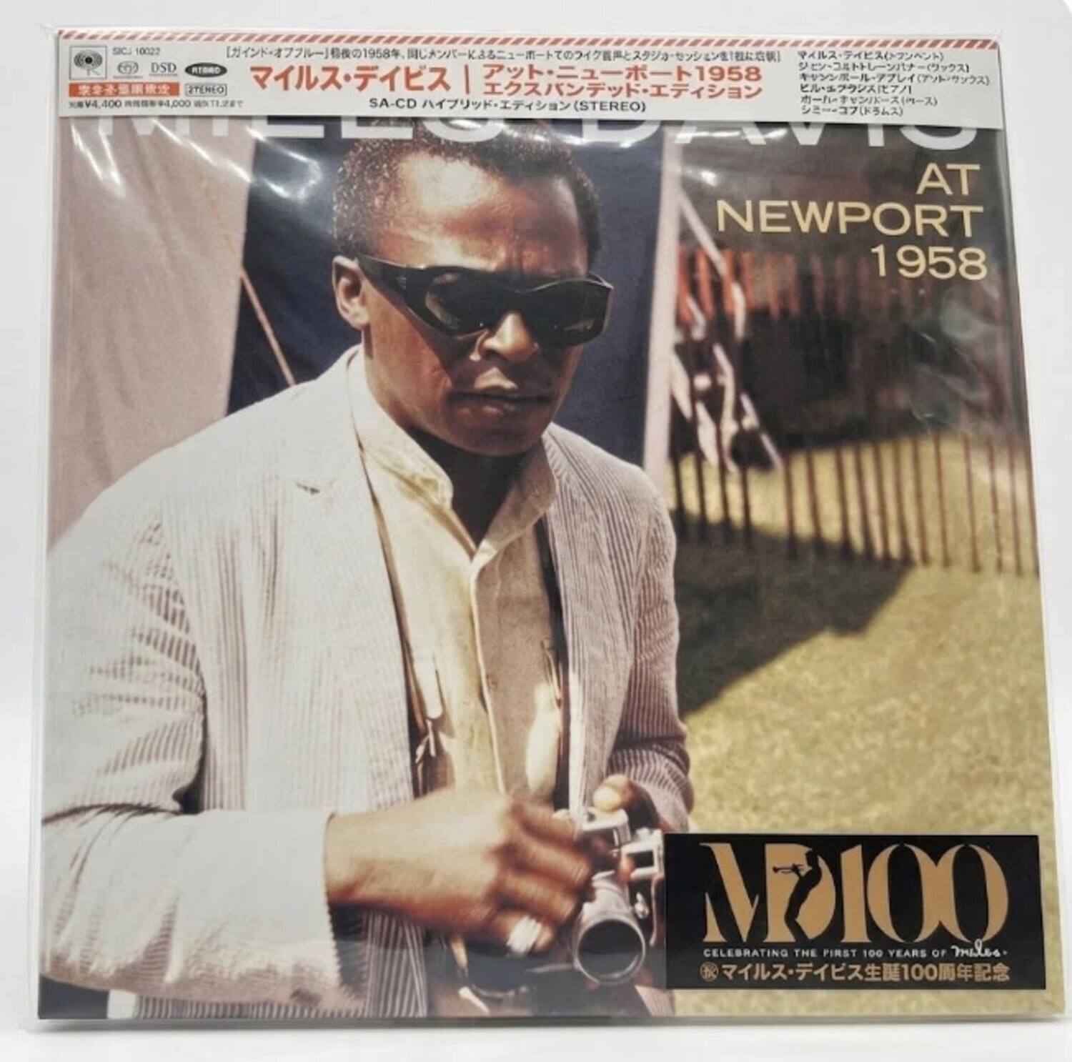 SIC 0022 1958  
DSD - () | 1958  
IENO 71  
4,400 +4,000  
TRI SA-CD () (STEREO) ()  
TNIARO AT NEWPORT 1958  
M7100 CELEBRATING THE FIRST 100 YEARS OF Miles 100