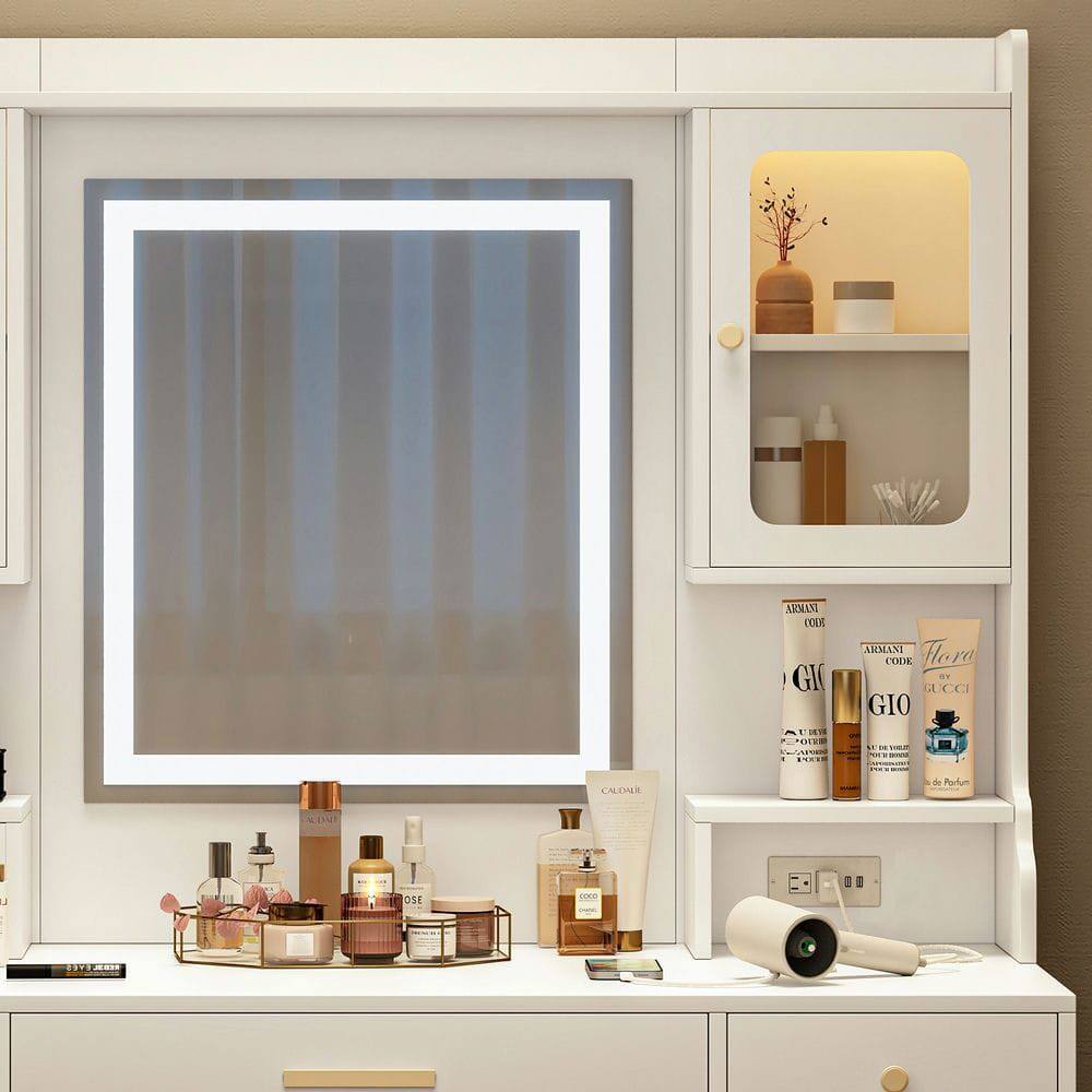 Certainly! Here is the corrected and grouped text from the image:

**Top Shelf:**
- ARMANI CODE
- GIORGIO ARMANI
- GIO
- ARMANI CODE
- GUCCI
- Hugo Boss
- CALVIN KLEIN

**Middle Shelf:**
- CALVIN KLEIN

**Bottom Shelf:**
- (Various smaller bottles and containers, labels not clearly readable)

**Additional Items:**
- (Various small bottles and containers on the vanity, labels not clearly readable)
- (A small camera on the right side of the vanity)