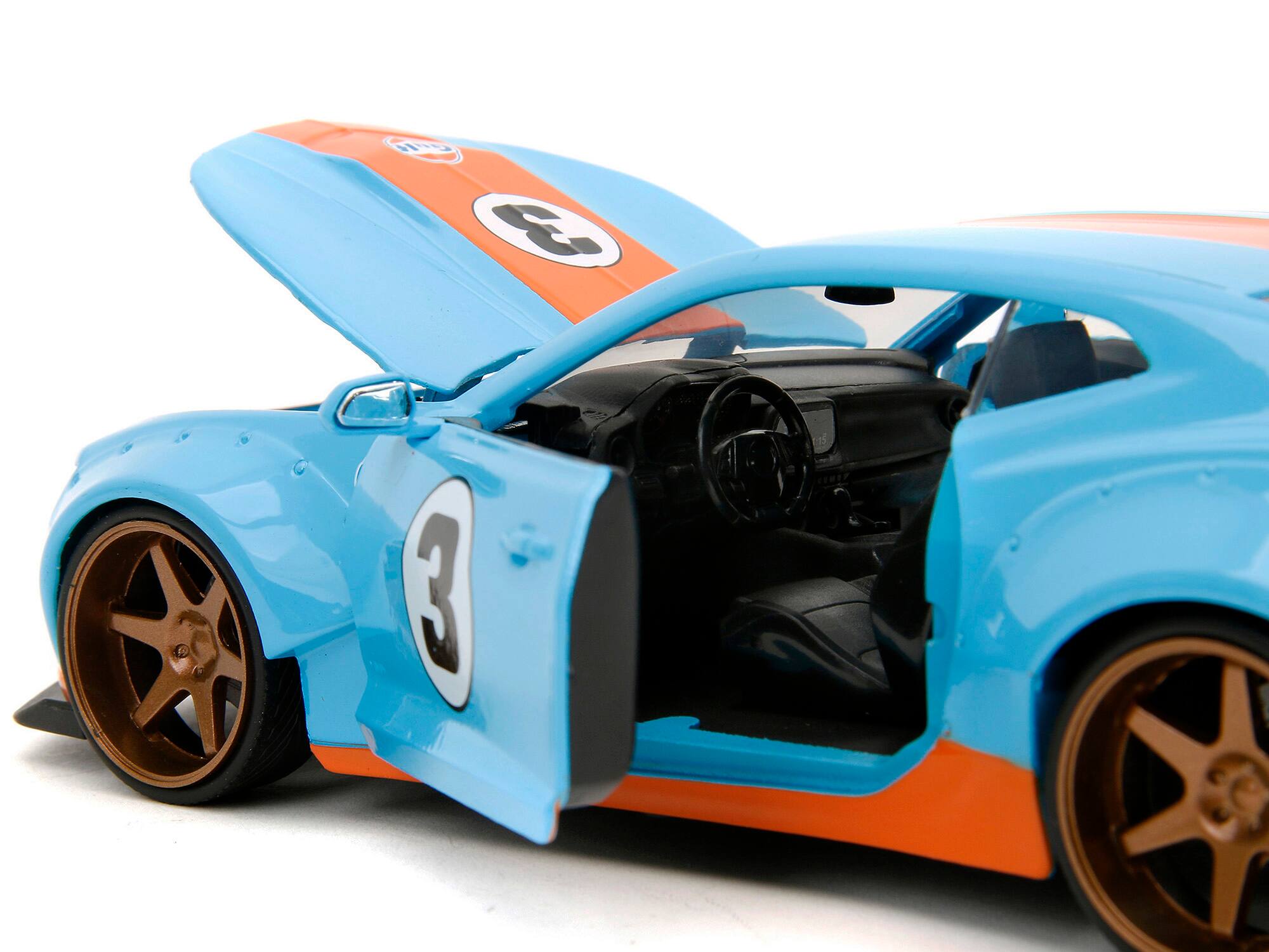 Left. Jada - 2016 Chevrolet Camaro Widebody #3 Light Blue with Orange Stripes "Gulf Oil" "Wide Body" Series 1/24 - Light Blue With Orange.