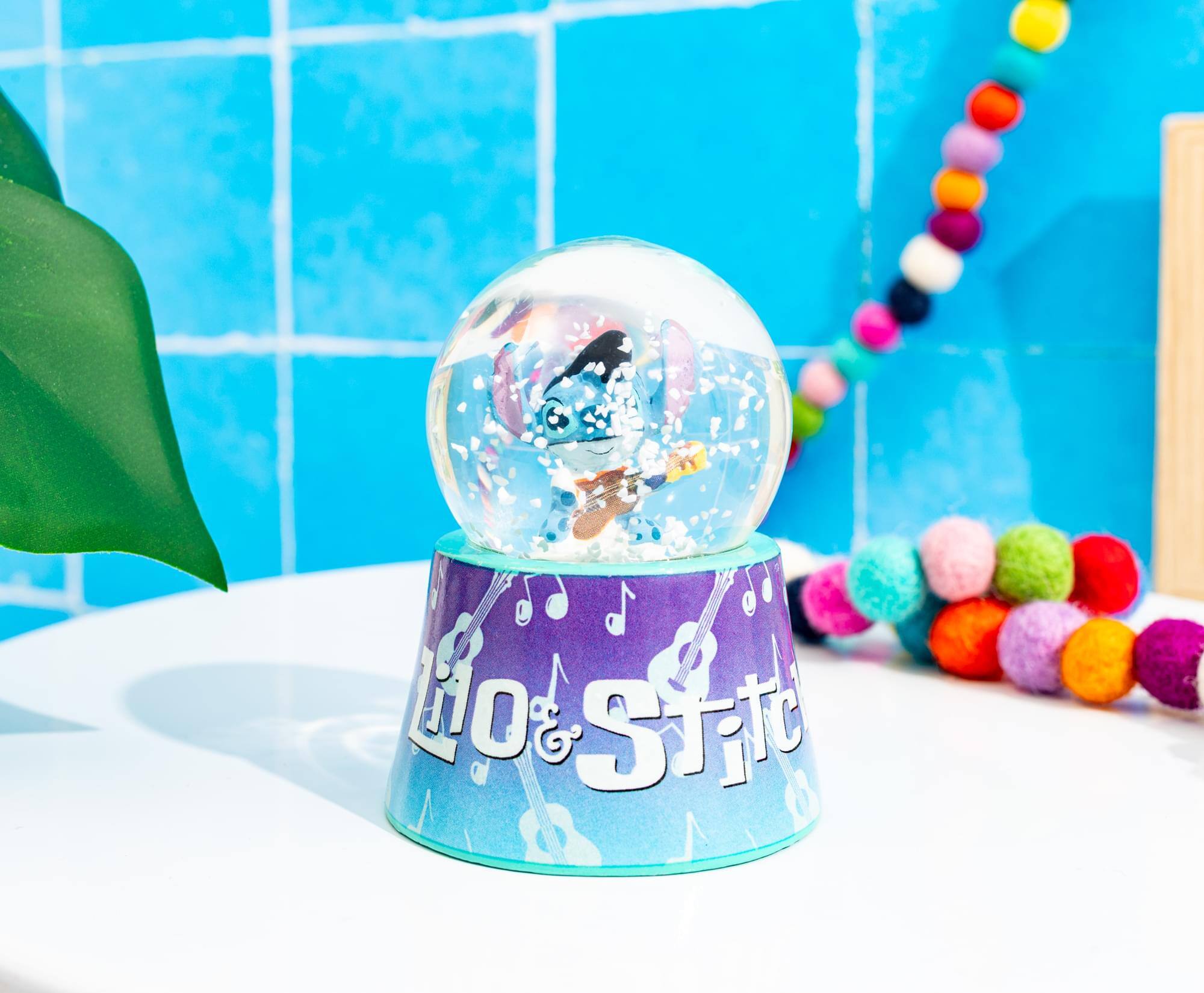 Alt View 4. Silver Buffalo - Disney Lilo & Stitch Elvis Stitch 3-Inch Mini Light-Up Snow Globe - Blue.