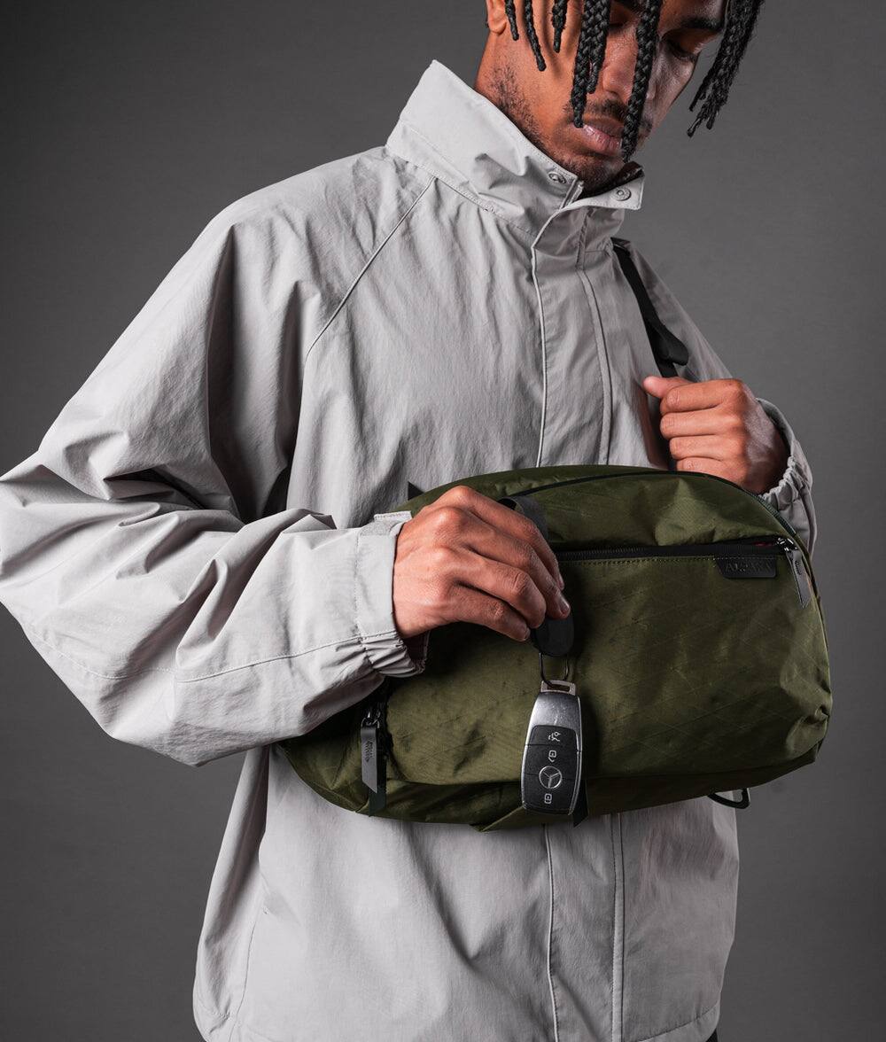 Alt View 2. ALPAKA - Metro Crossbody Left Shoulder Sling Bag Men,Sling Backpack - Fits 11" Tablet - Single Shoulder - Olive Green X-Pac X42.